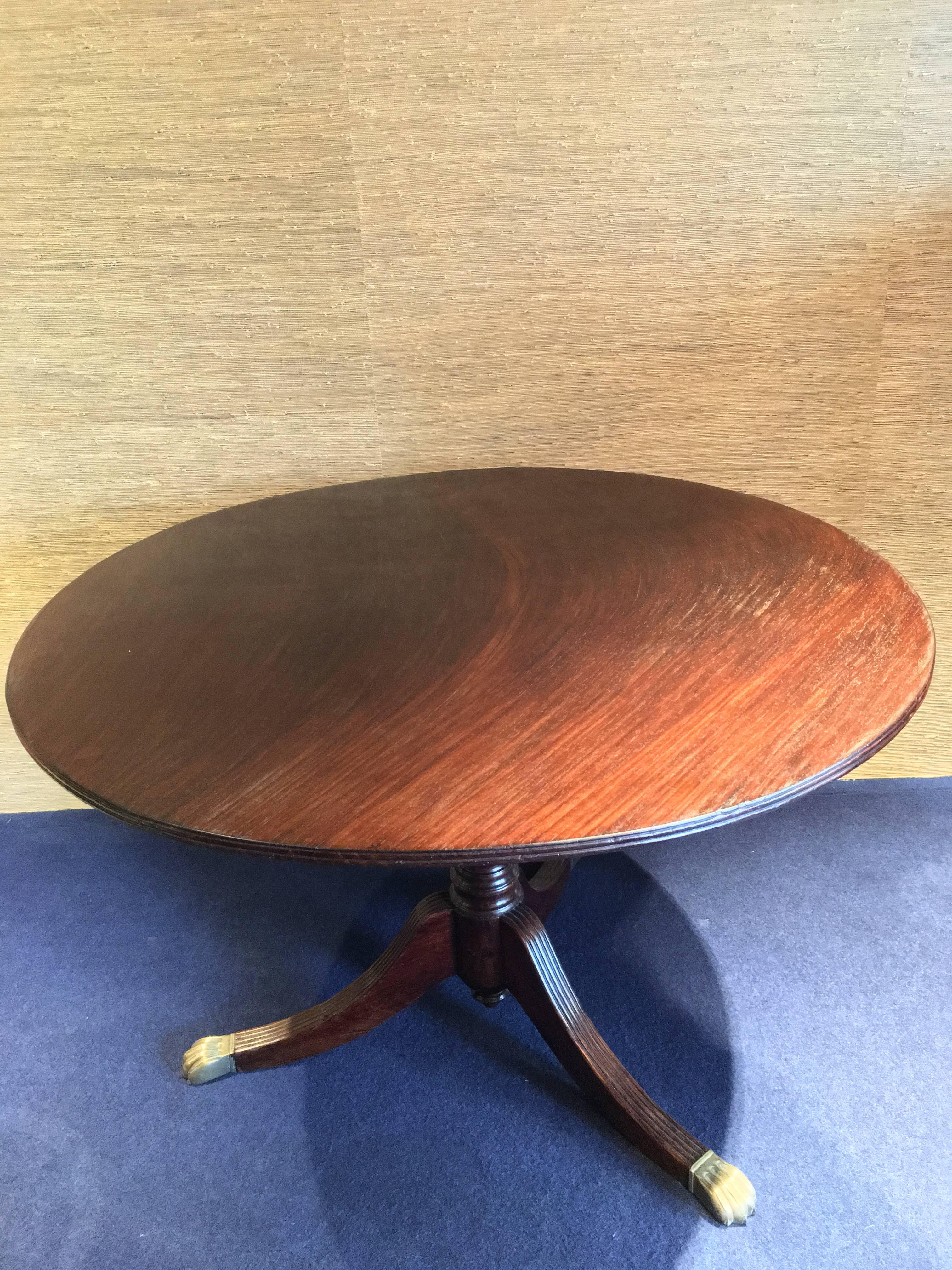 So elegant round vintage table. Wood and brass lions on the feet. 1940 period. Made in Italy. Already restored. For much more info and pictures do not hesitate to contact us. The item is removable (base and round plan). (For your safe shipping we