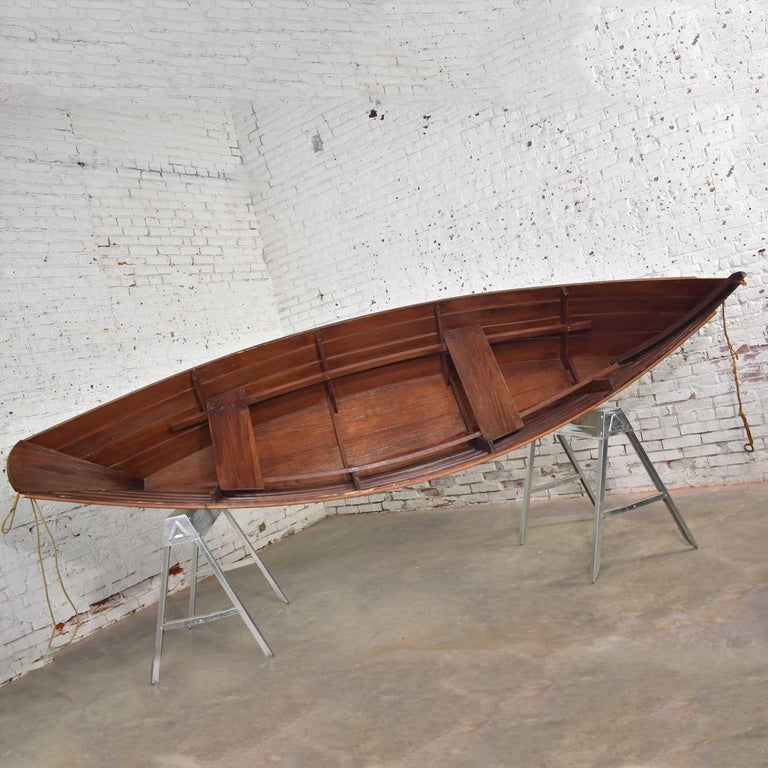 vintage wooden rowboat for maritime or nautical décor for
