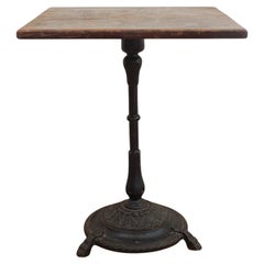 Mesa auxiliar vintage de madera con base de hierro