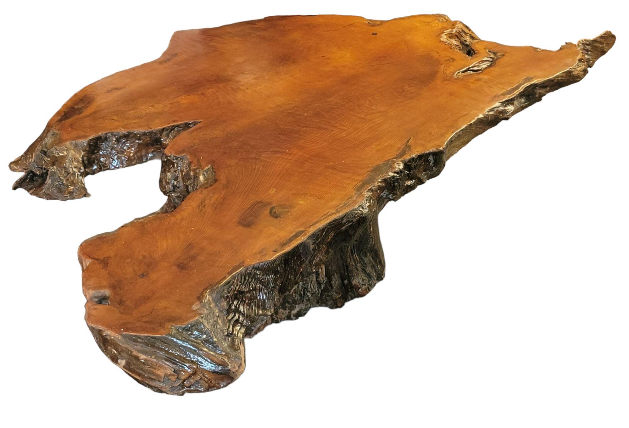 Adirondack coffee table made from 2 large tree slabs. The tabletop has a burnt wood finish giving it a darker more refined look. Would go great in a mountain  log cabin setting, resort  or country setting. 

Chipped Wood Design Adirondack style slab