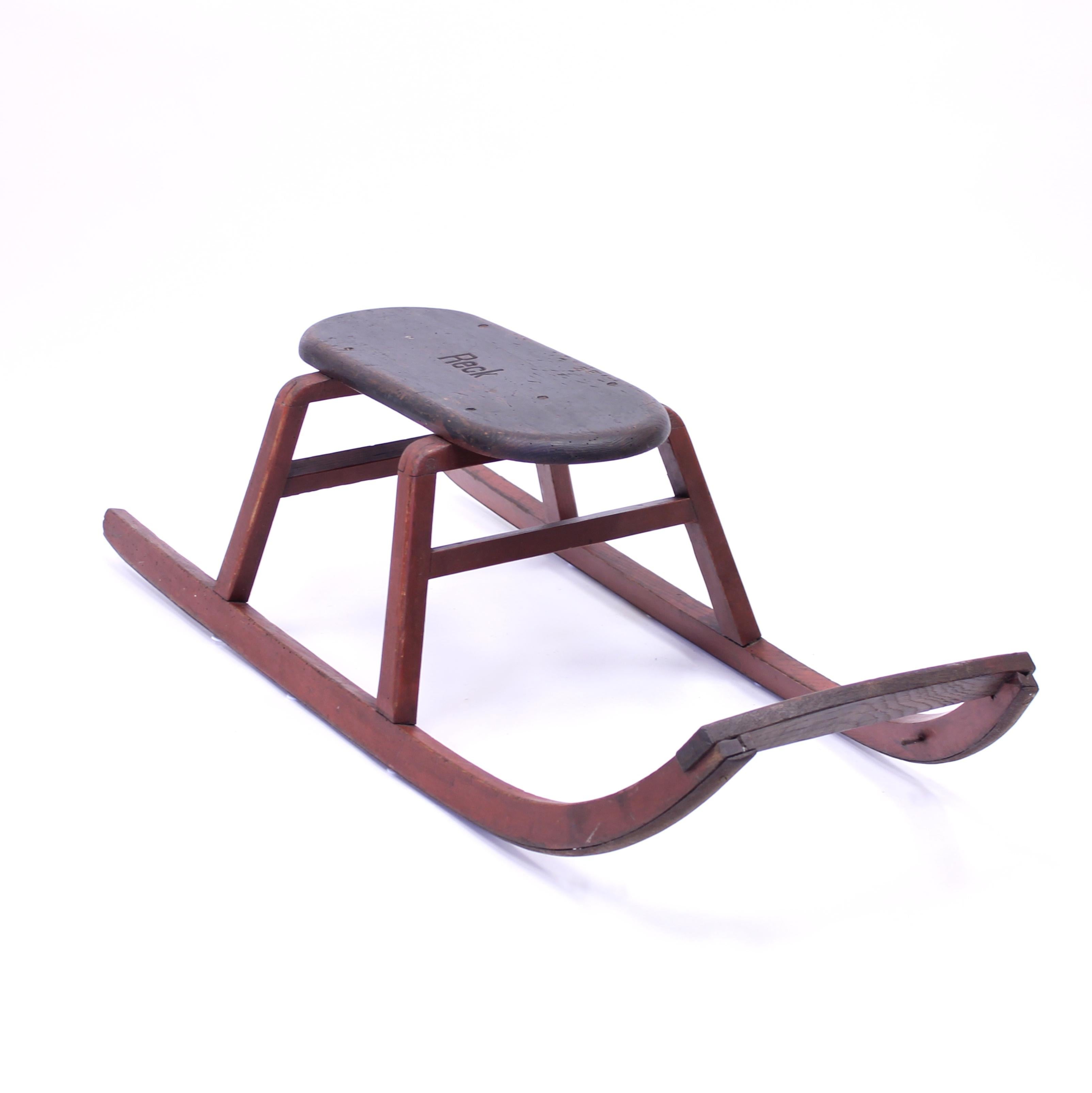 vintage wooden sleds with metal runners