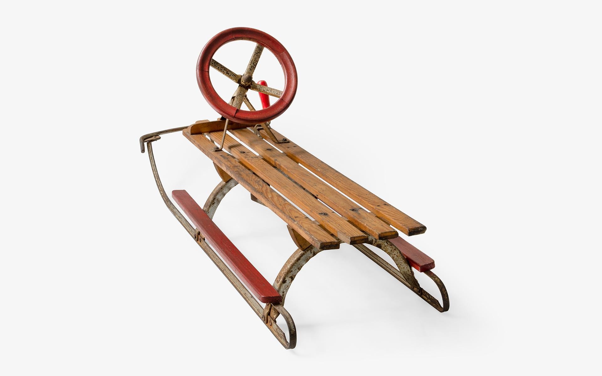 antique wooden sled with metal runners