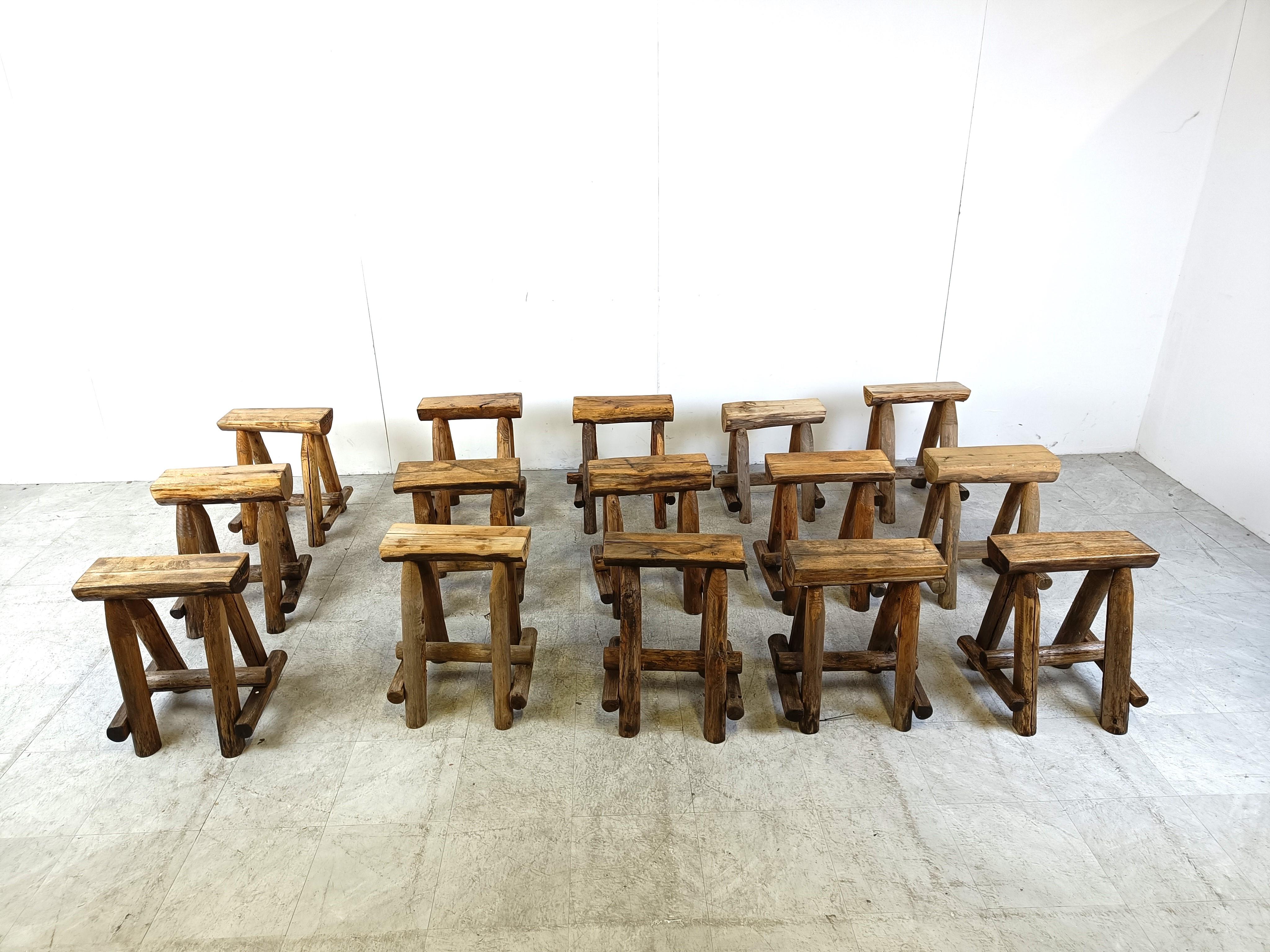 Primitive and sturdy handmade oak stools

Timeless, decorative pieces

The seats are made from cut in  half tree logs.

Multiple pieces available, price is per piece

Engraved with makers mark.

1950s - Belgium

Good condition

Dimensions:
Height: