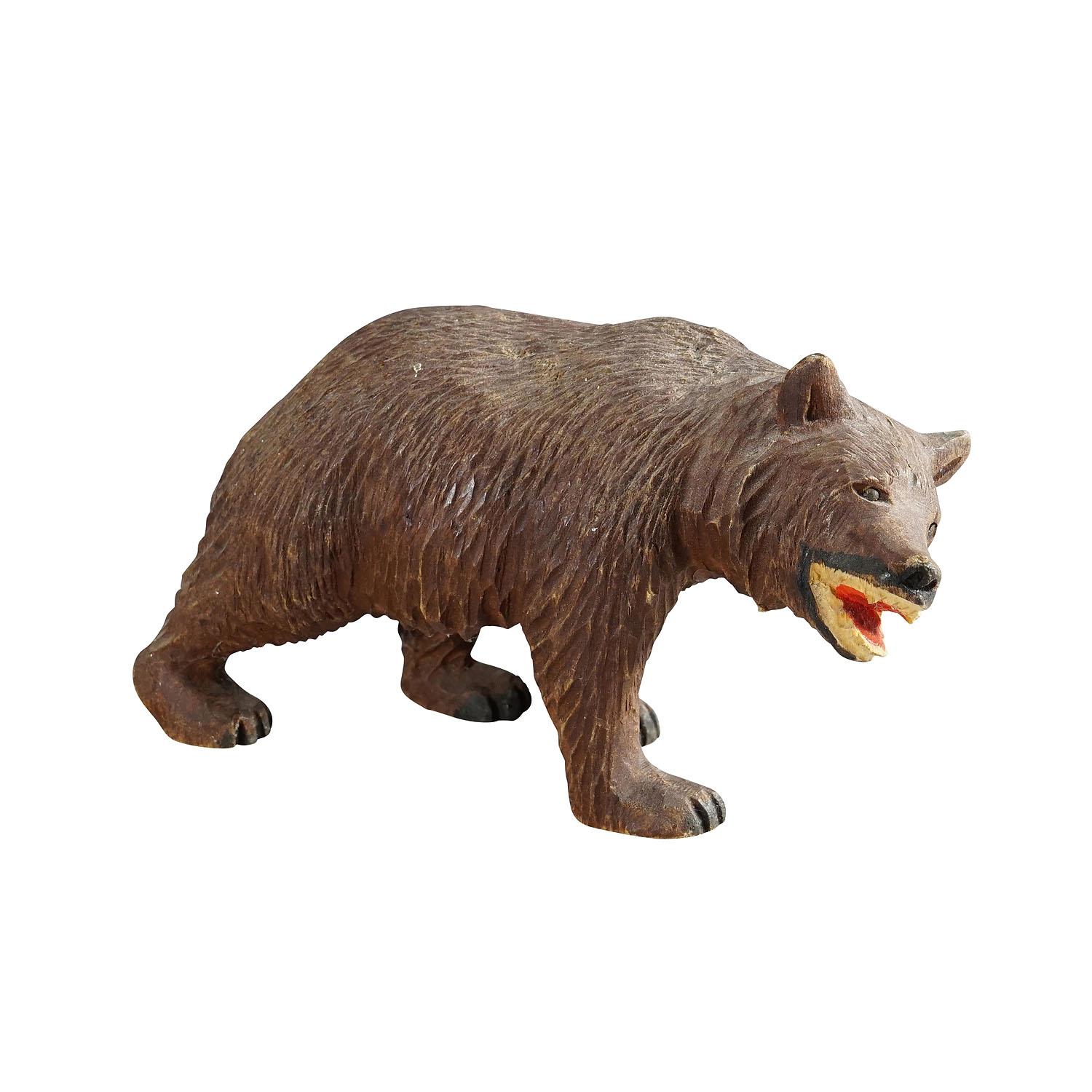 Vintage Wooden Strolling Bear Handcarved in Brienz ca. 1950

A vintage statue of a walking bear. Made of lindenwood, finely handcarved with naturalistic details in Brienz, Switzerland ca. 1950. A nice example of the famous Black Forest Woodcarvings