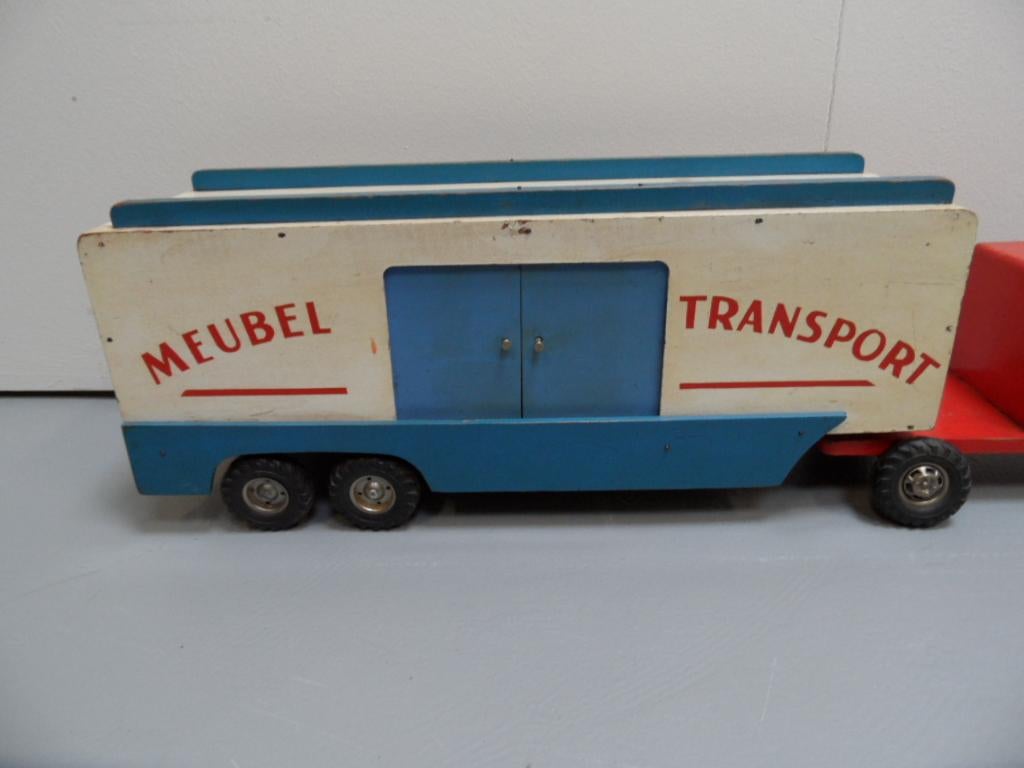 Original vintage wooden truck made for children. The truck is complete with doors on the side.
The toy is made in the 1960s.