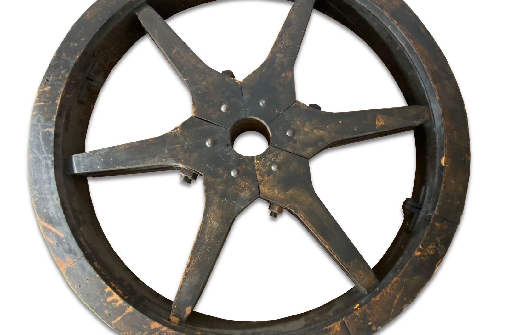 Nice vintage foundry pattern in the form of a wood wheel with 6 large spokes. This industrial wood form has the original nuts and bolts that join the sprocket and the wheel. Great display piece for that industrial look.

Property from esteemed