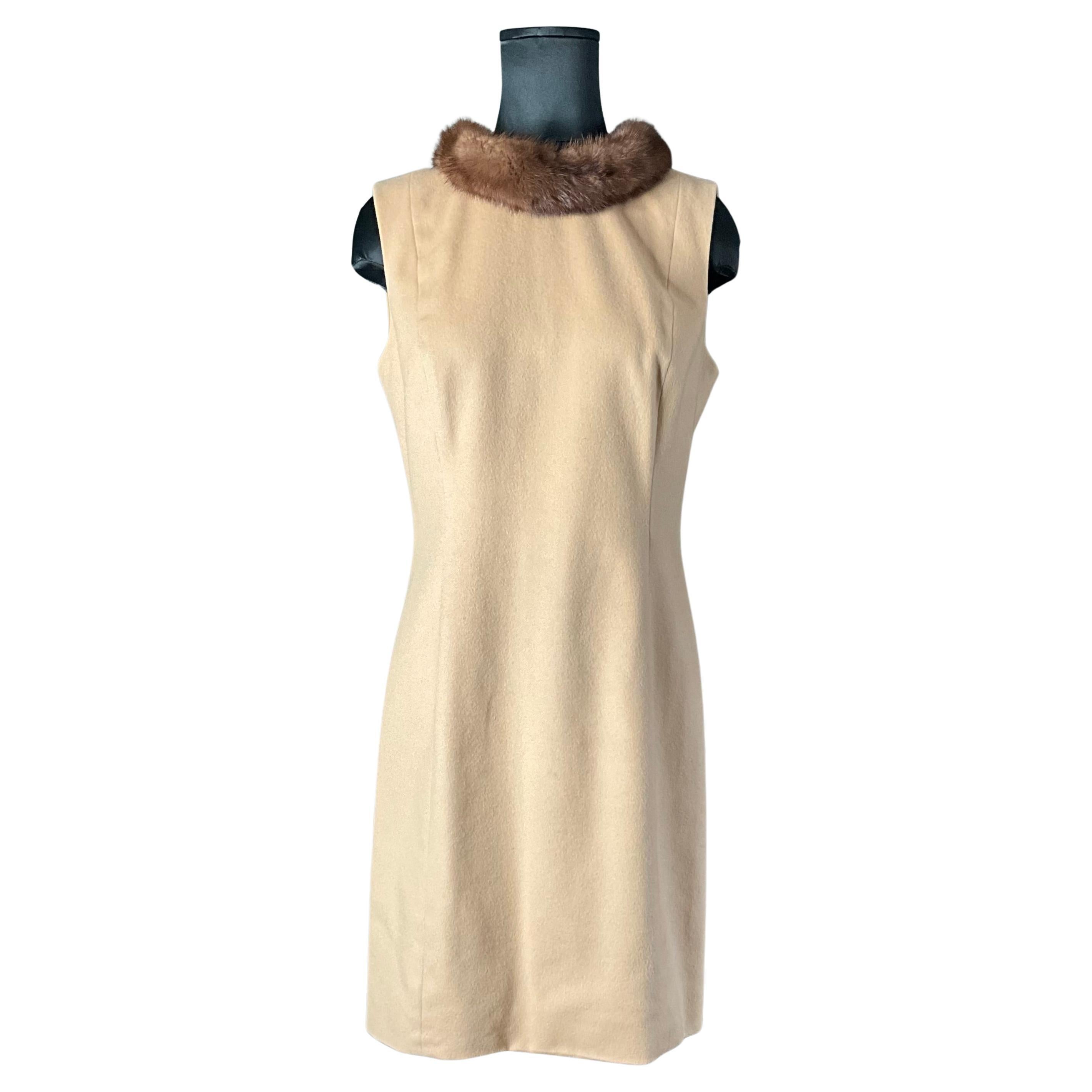 The Vintage Wool Cashmere Sleeveless Shift Dress with Mink Trim Neckline is an elegant and luxurious piece that combines timeless design with high-quality materials. Made by Badgley Mischka, the wool-cashmere fabric offers warmth and comfort, while