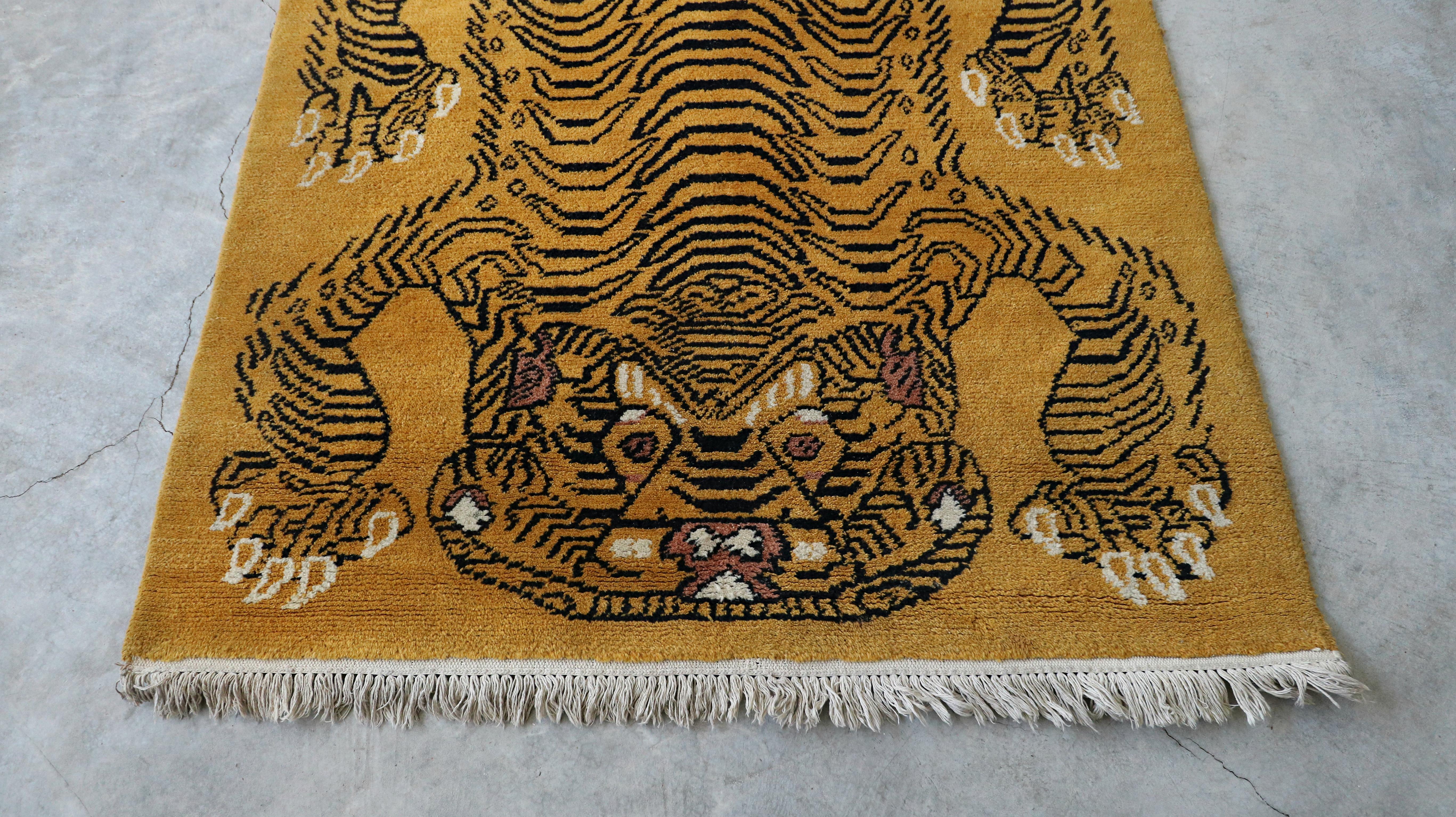 Beautiful vintage, 1960's, Tibetan Tiger Rug, in a rich butterscotch, black and cream color, high pile wool, that is soft under the feet. It would make the perfect bedroom, living room or mediation space carpet.

Rug is in excellent condition