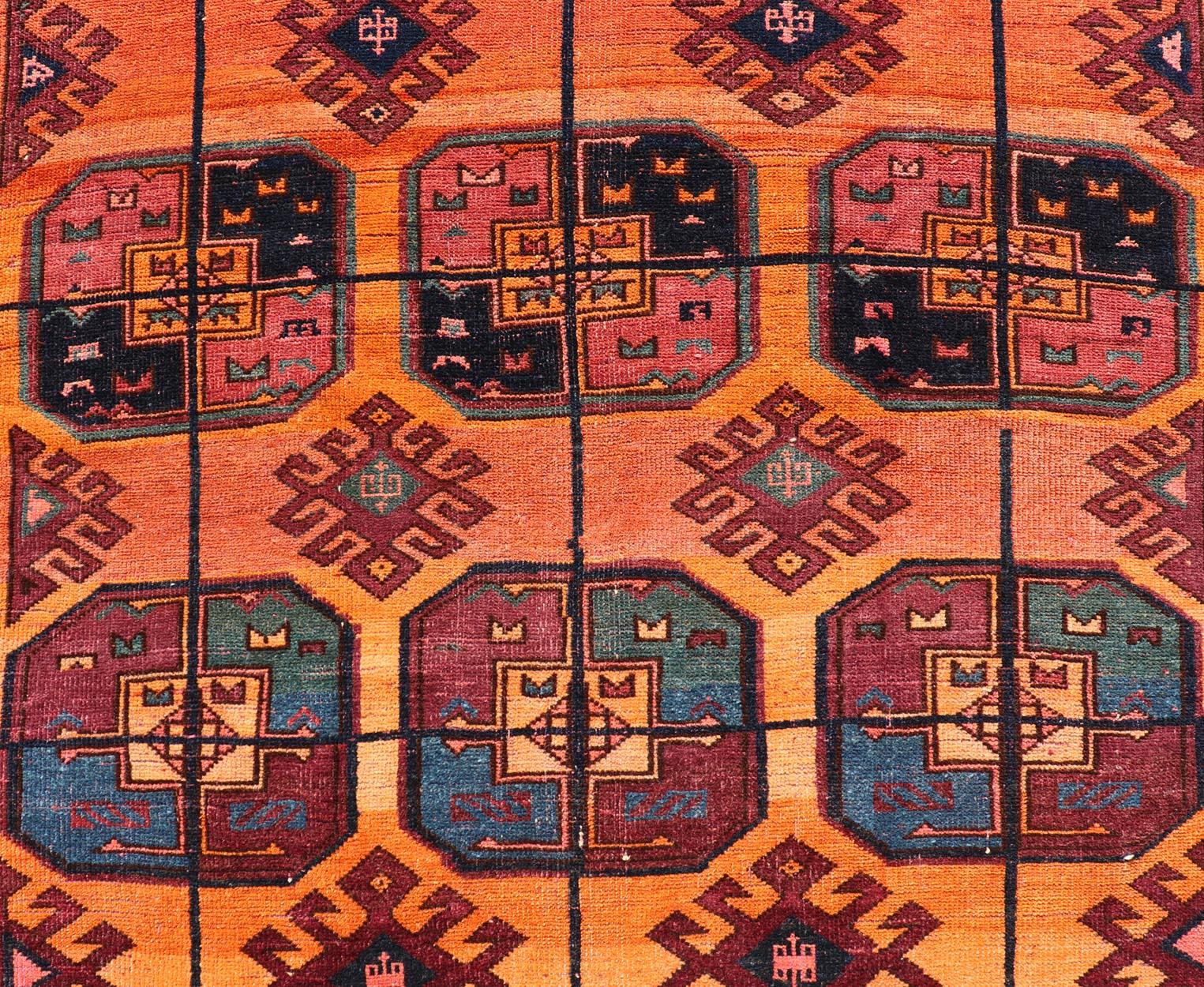 Tribal Vintage Wool Ersari Rug in Wool with Gul Design in Orange, Blue, and Brown For Sale