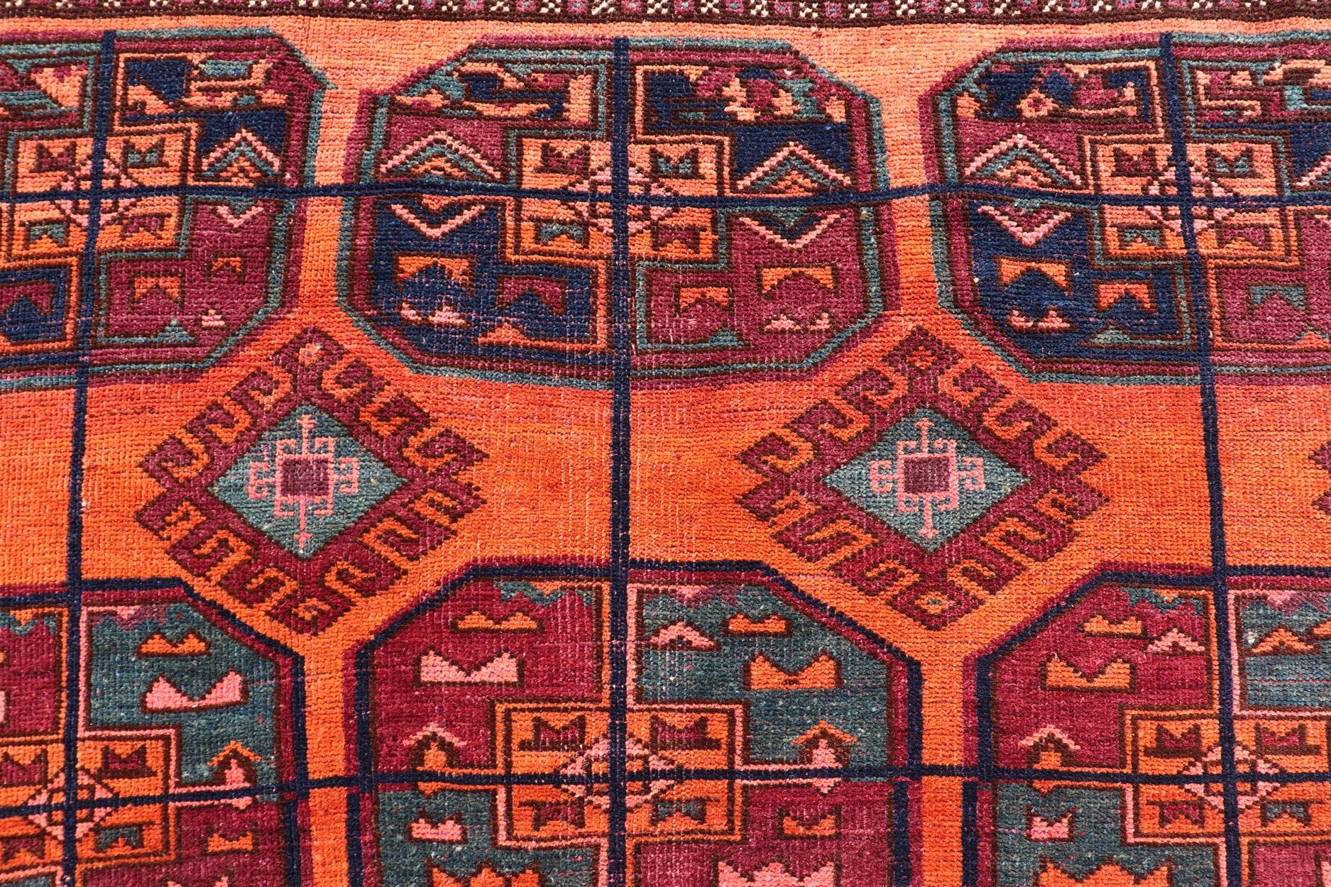 Turkmen Vintage Wool Ersari Rug in Wool with Gul Design in Orange, Blue, and Brown For Sale