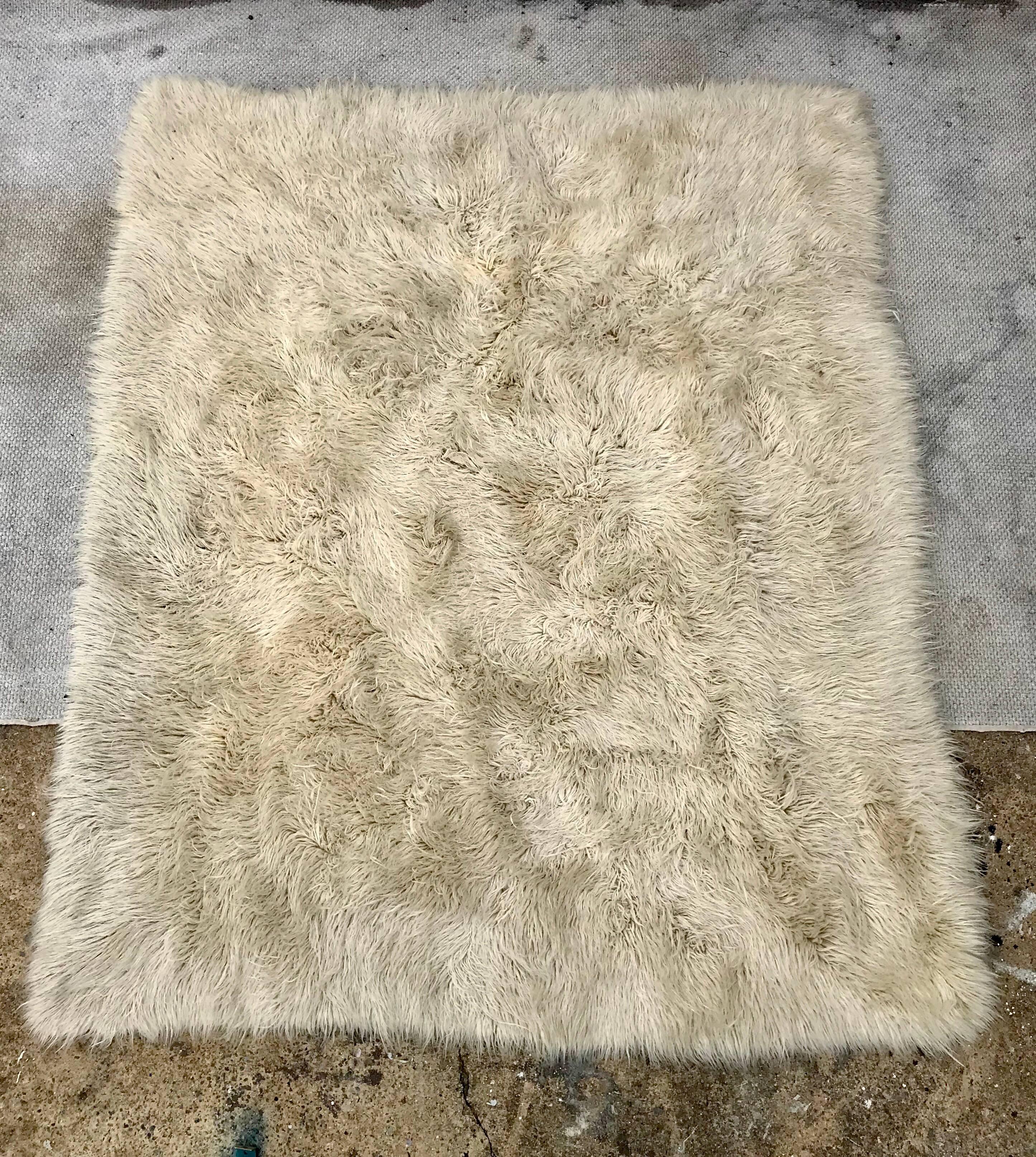 A high quality vintage 100% wool flokati rug by Athens, Greece rug maker Karamichos & Co. Boho chic hipness that feels as good as it looks.