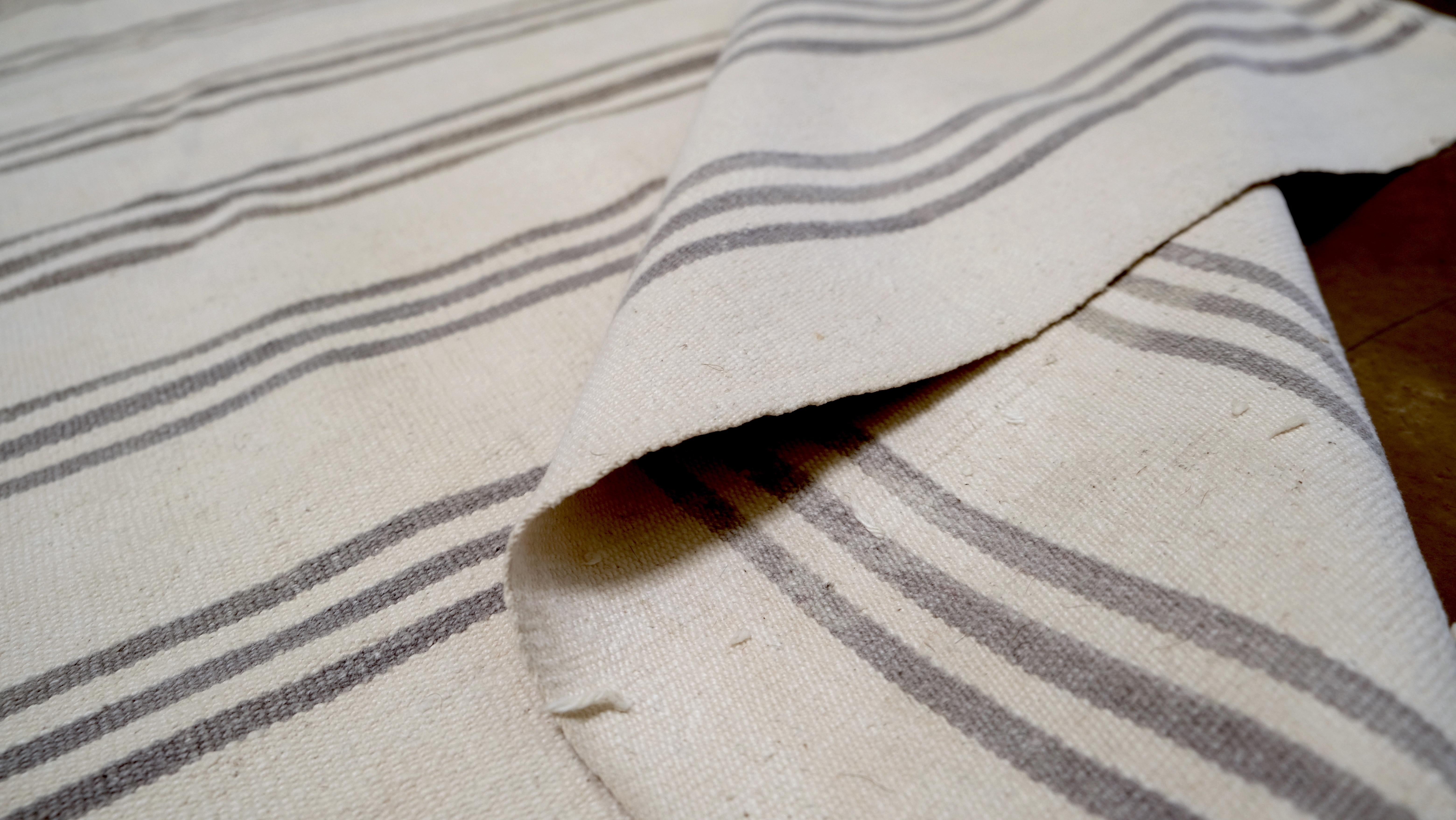 The clean and elegant linear pattern offers versatility, making it a perfect choice for modern, Scandinavian, or transitional interiors. Its understated sophistication adds a layer of warmth and texture to any space.

Meticulously crafted by skilled