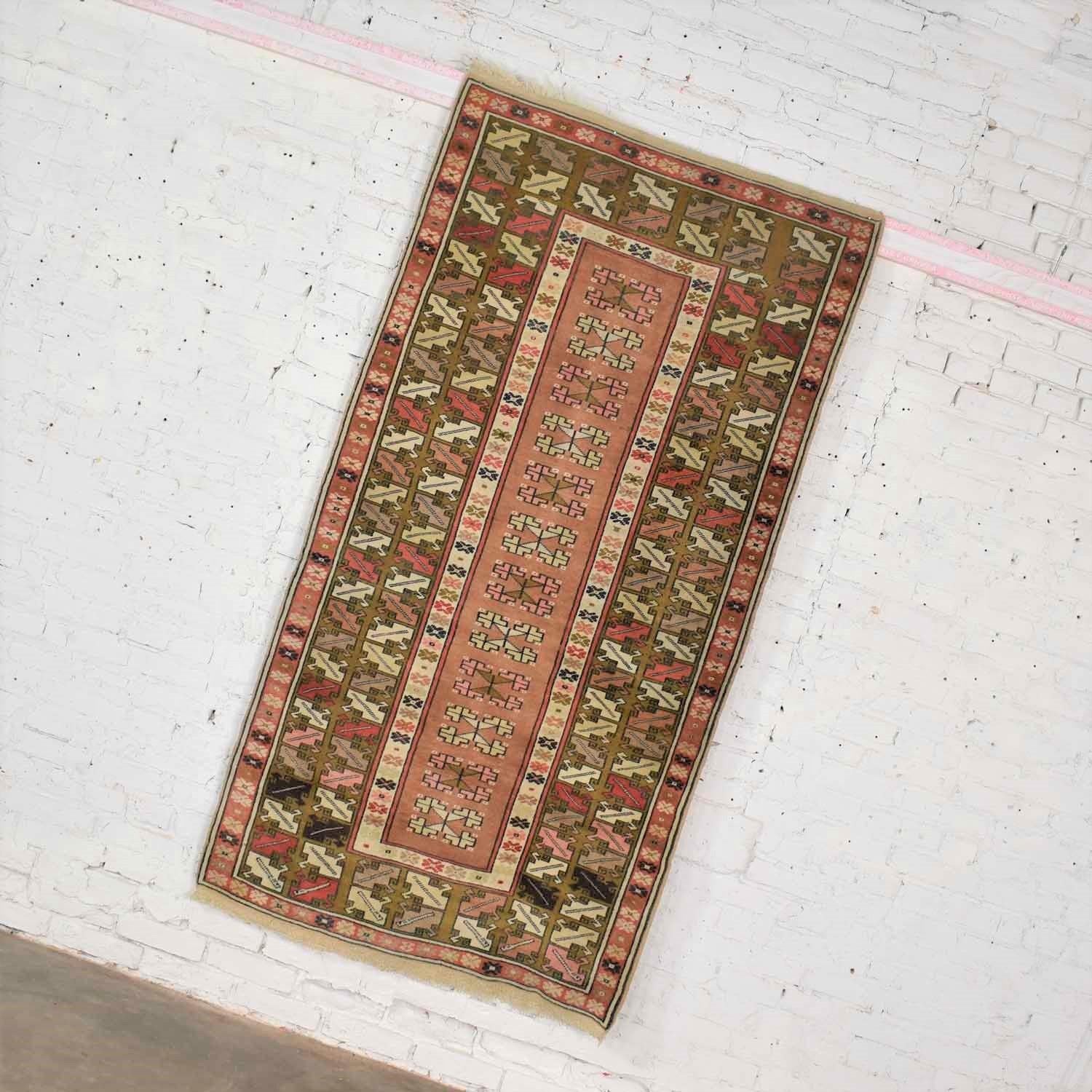 Handsome vintage handwoven Turkish wool rug in the Milas style. It is 6’7” x 3’6.5” and in wonderful vintage condition. It has been cleaned and is ready to use. Some fringe is missing. Please see photos, circa early to mid-20th century.

I am