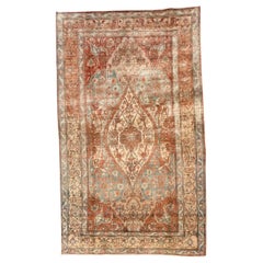 Tappeto turco in lana vintage nei toni del blu e del ruggine