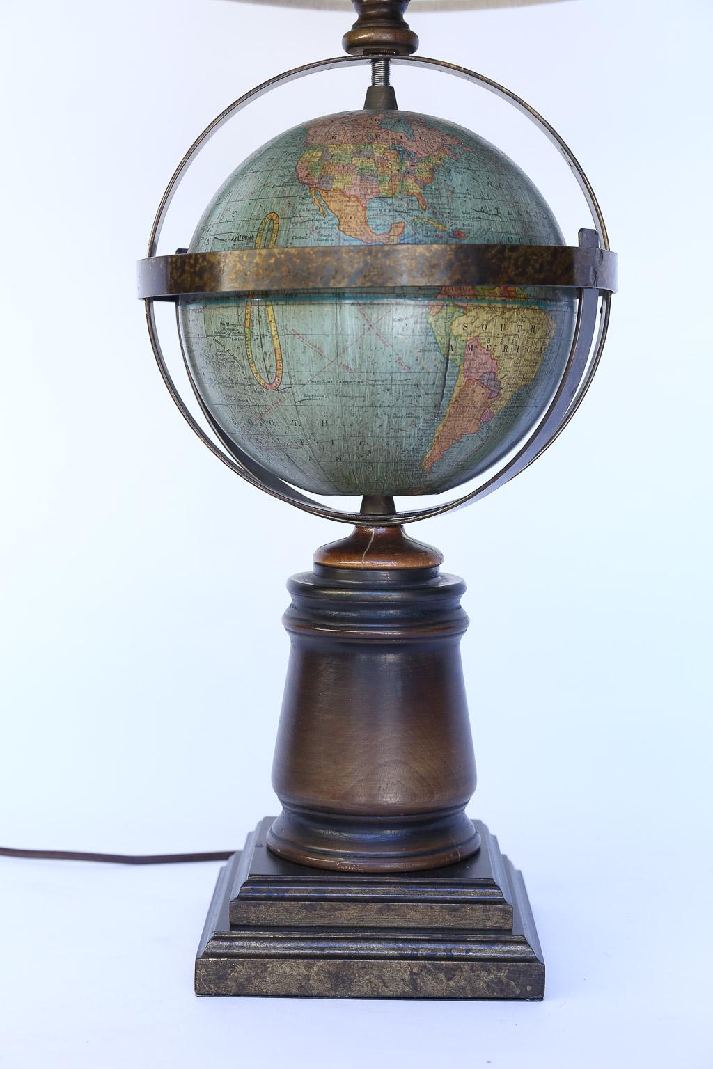 This vintage world globe lamp will be perfect for a study or den. The globe itself is 8 inches in diameter. The linen shade is 13 inches in diameter and 9 inches high. Dimensions below are for the lamp itself including the harp and finial. The globe
