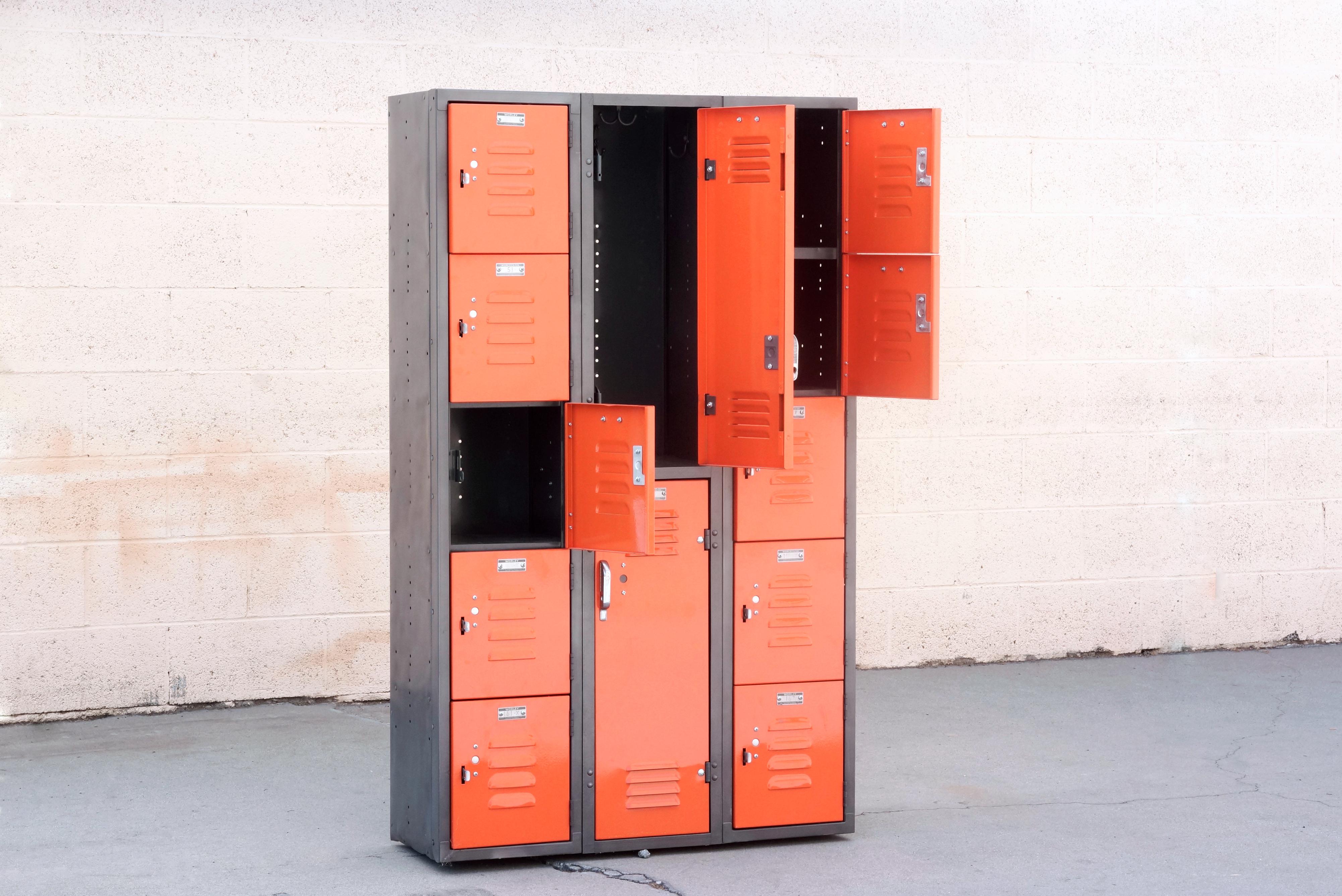 This vintage locker unit features authentic 1960s Worley locker doors in a custom built steel frame. Doors have been powder coated in in Tangerine (OG01). With 5 cubby doors and 2 vertical doors, it’s an excellent shared storage solution for a
