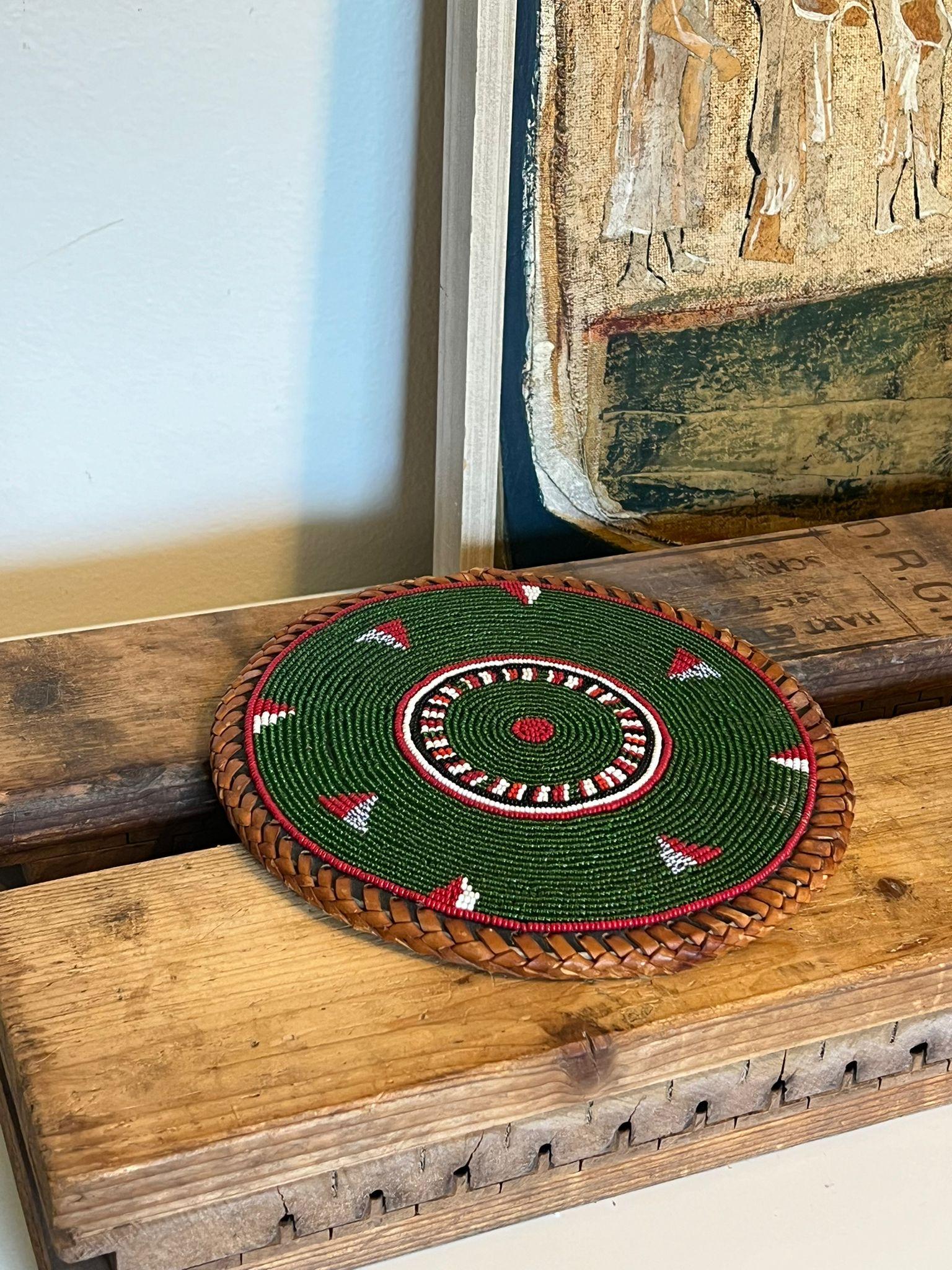 Possibly meant to be a placement, coaster or table decor. Vintage handwoven and beaded. This Piece has nice patina and character. Vintage Condition as pictured. Listing is for described item only. Online purchase only. Box H7

Dimensions. 8”