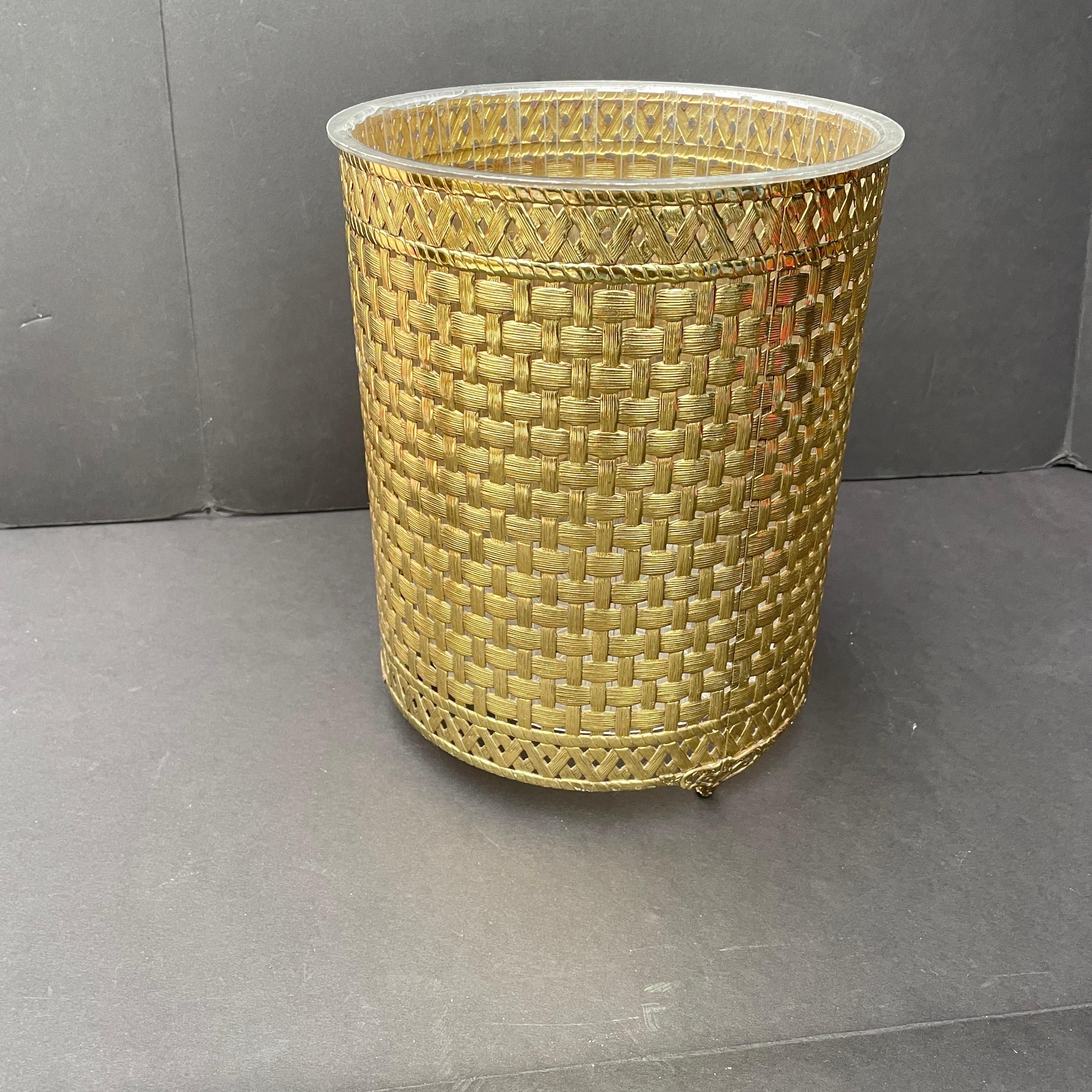 Brass waste can with decorative ring handles and a removable liner in a Mid-Century Modern Regency style. A sexy look for an office, bathroom, bedroom, hallway.