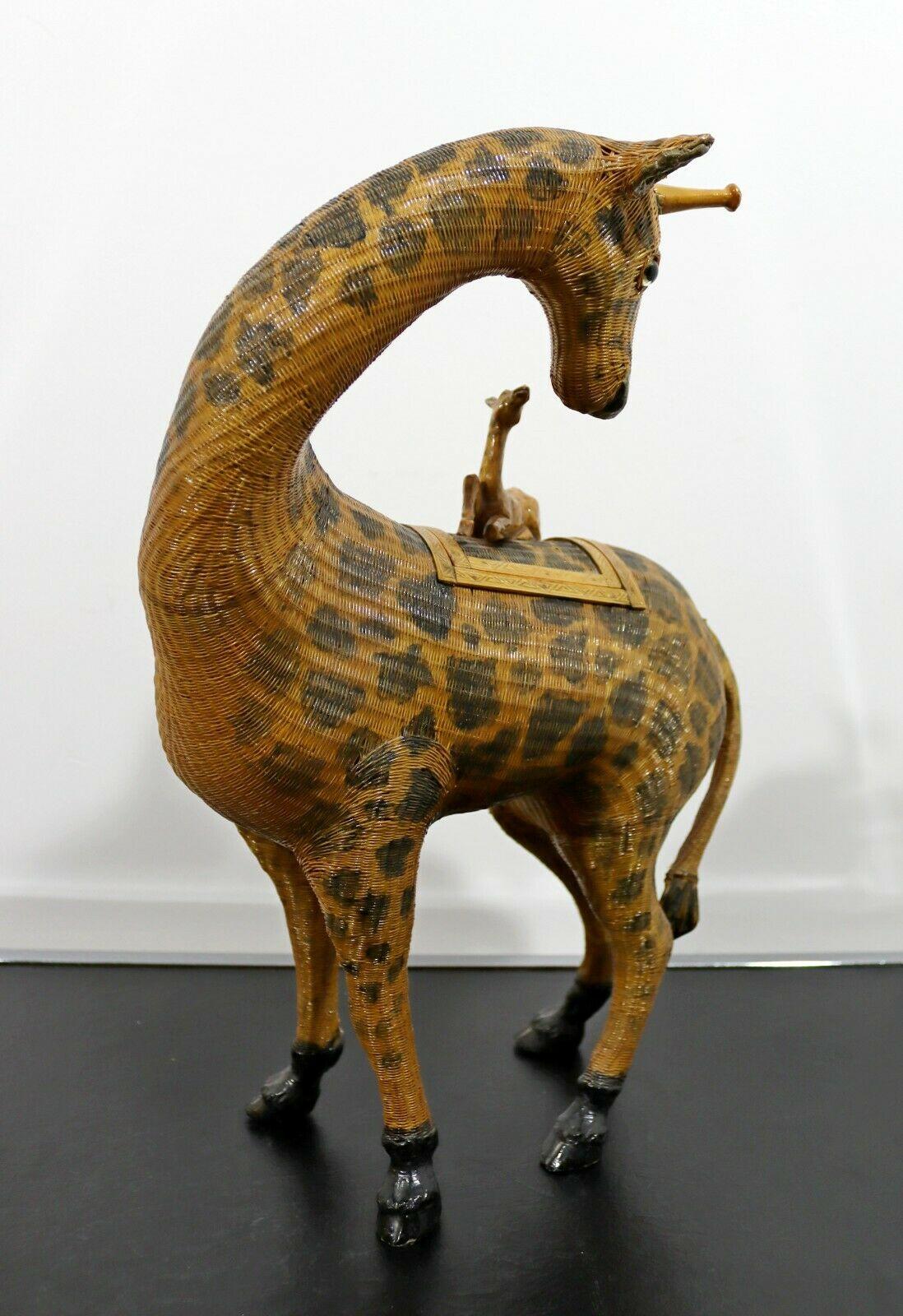 Stunning accent piece! An elegant vintage woven Chinese giraffe sculpture. This has an interesting composition with a baby giraffe on the back, which is also the lid top. In excellent vintage condition. 

Dimensions: 17