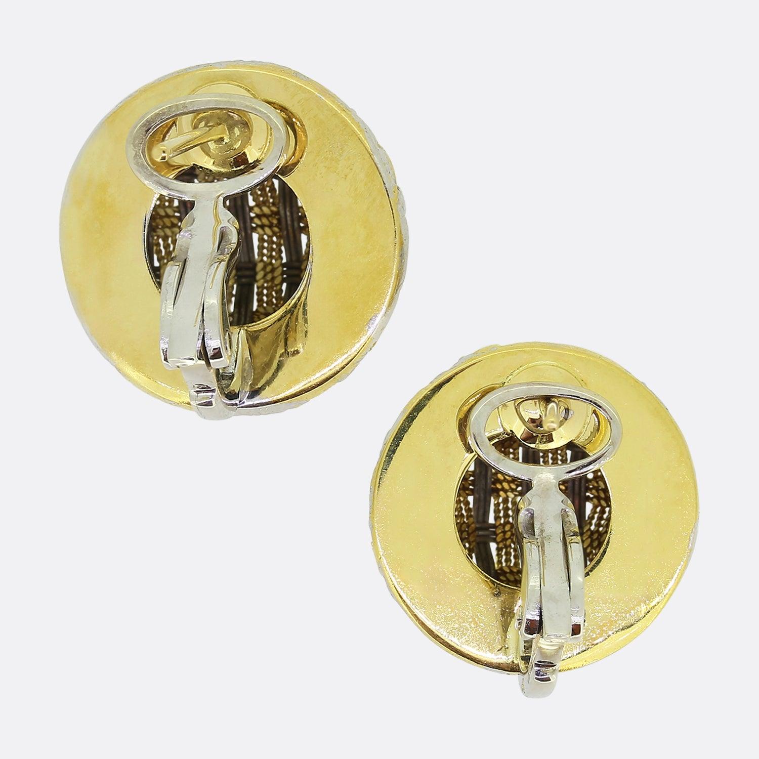 Here we have a lovely pair of vintage woven earrings. Each piece has been crafted from 18ct gold into a circular domed shaped with both identical earrings showcasing a yellow gold roped design entwined with a white gold interlace. 

Condition: Used