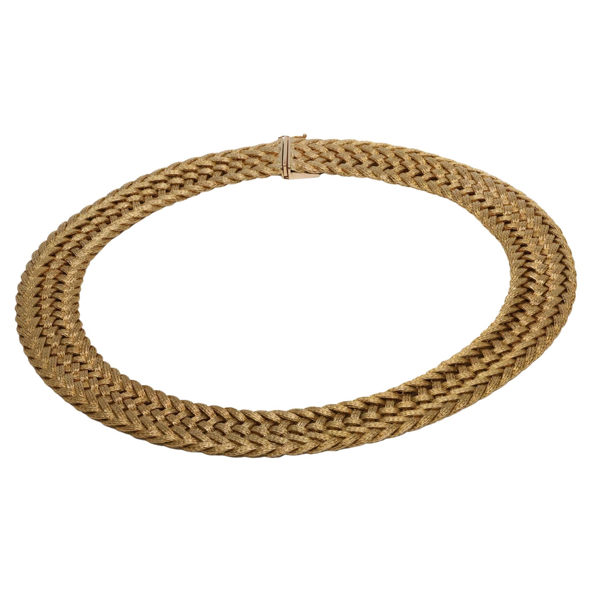Vintage Woven Gold Necklace in 18k Yellow Gold

Experience the timeless elegance of this vintage woven gold necklace, expertly crafted from luxurious 18k yellow gold. This stunning piece showcases exceptional craftsmanship, draping gracefully around