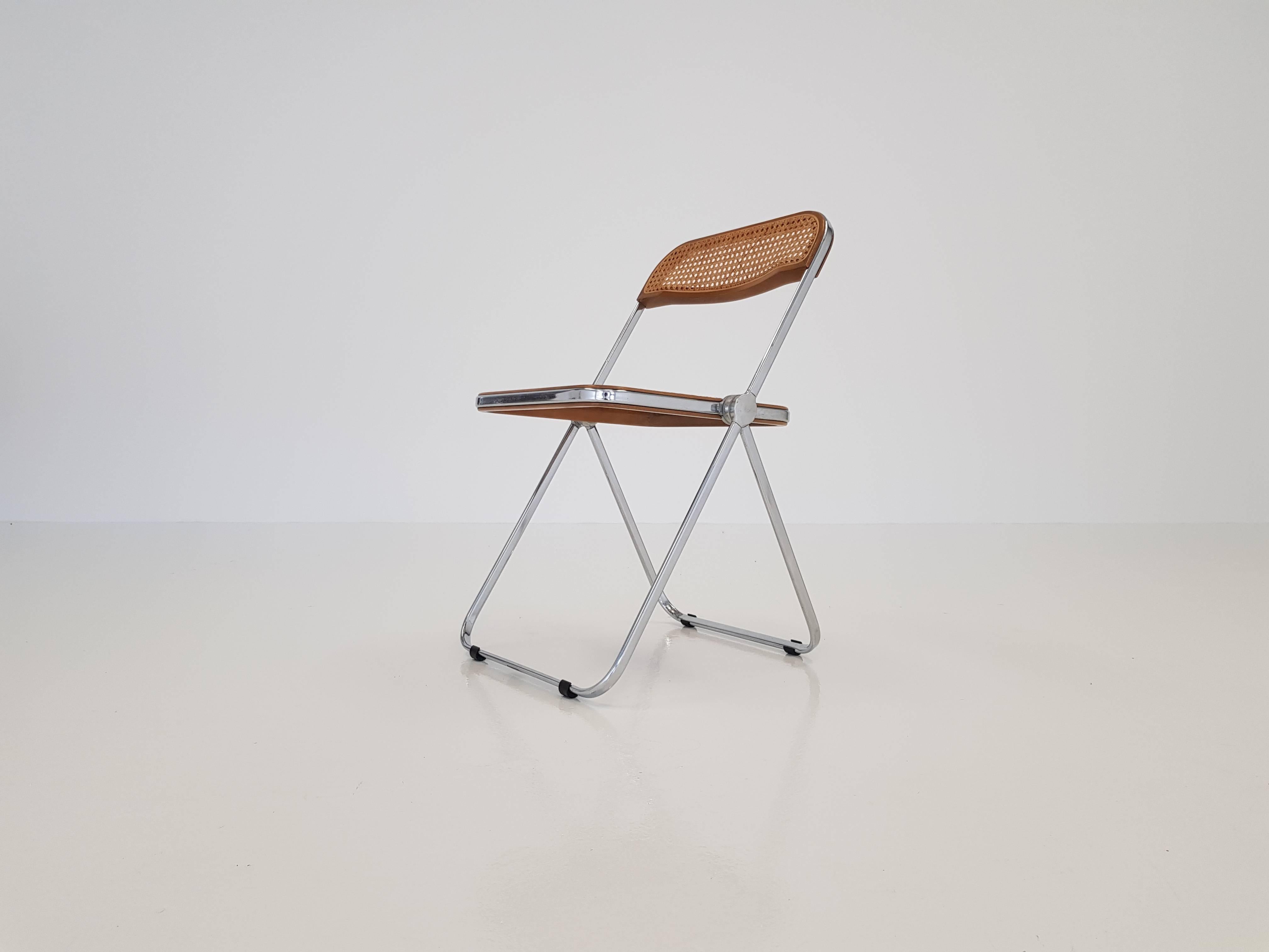 Design classic Giancarlo Piretti for Castelli 'Plia' chair.

This piece in rare woven wicker and walnut on chromed base.

