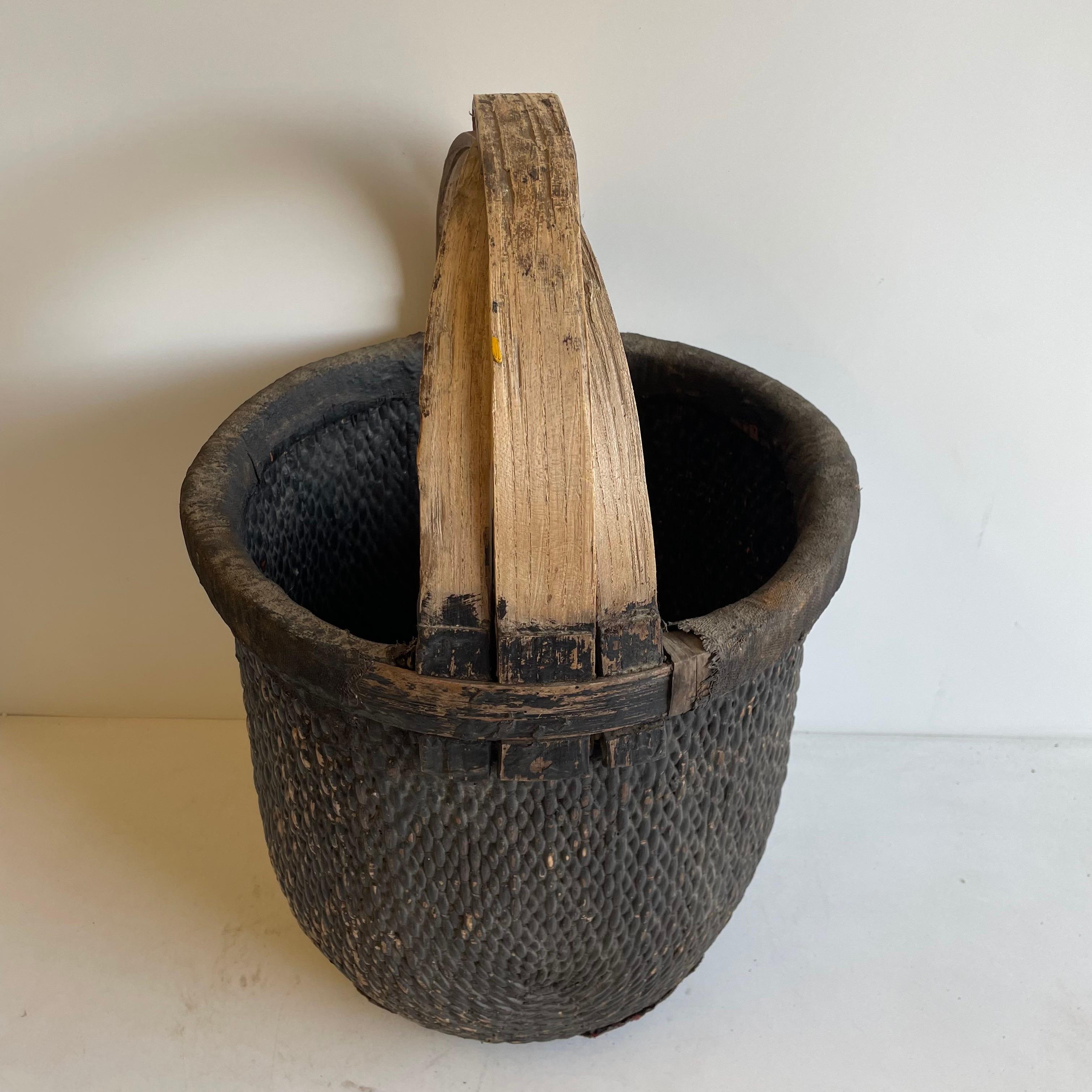 Vintage woven wicker basket with handle
Size: 15.5 x 15.5 x 24
Origin: Asia
c20th century.