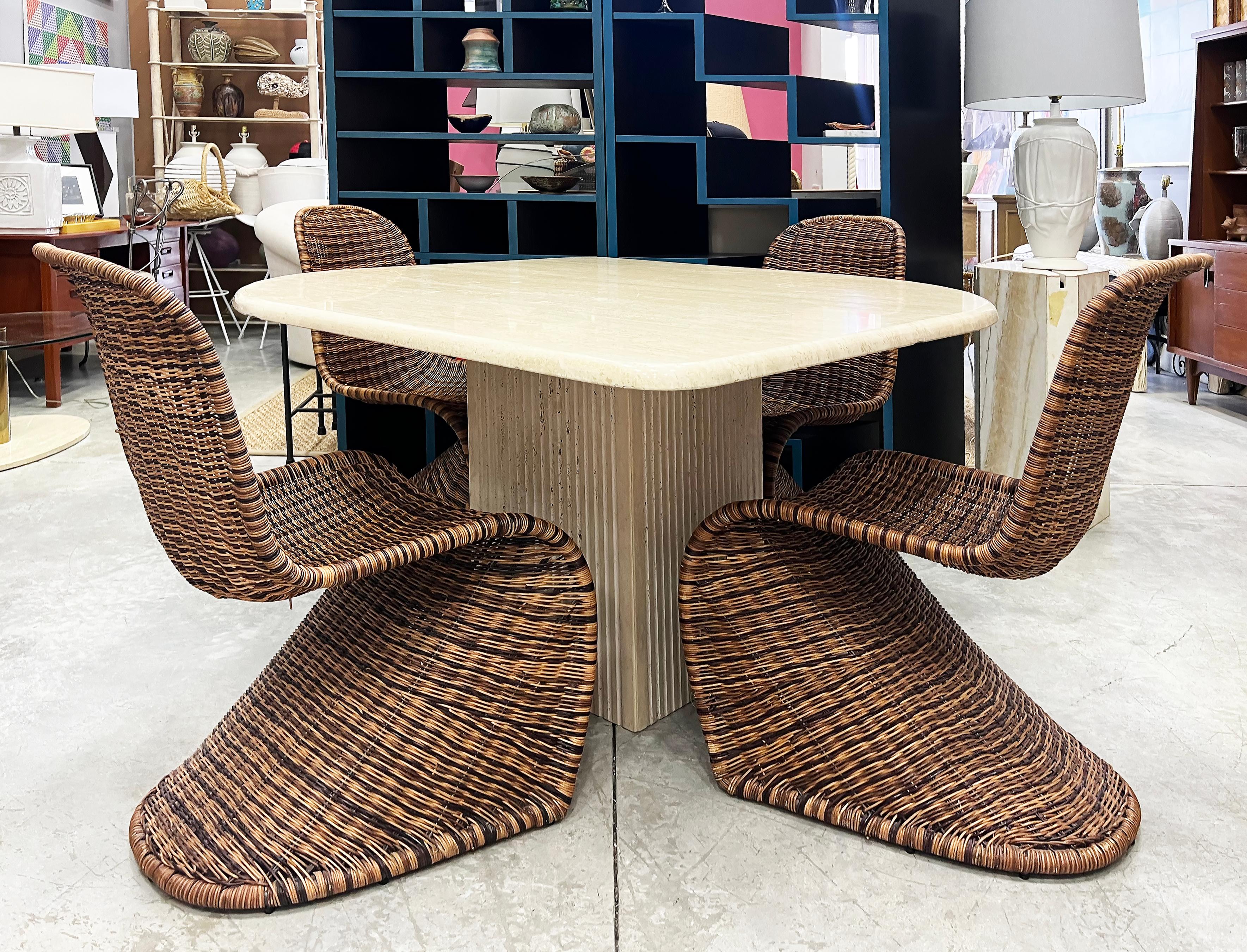 Vintage Woven Wicker Dining Chairs in Verner Panton Form, Set of 4 

Offered for sale is a late 20th-century set of 4 Woven wicker dining chairs created in the manner of Verner Panton. The chairs have metal frames that are wrapped with wicker in