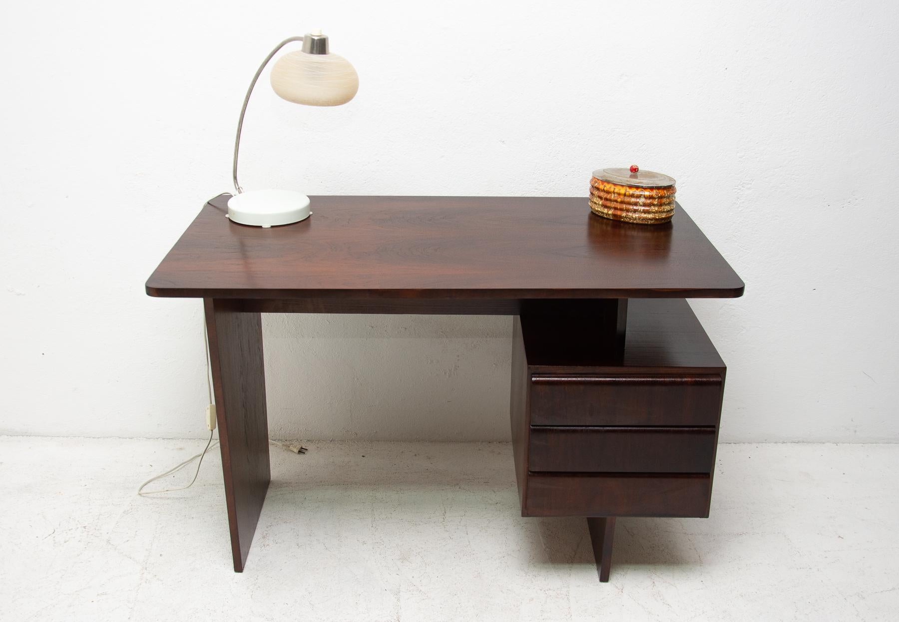 This desk was designed by Bohumil Landsman in 1970s for Jitona company. The design is very simple and elegant. It features a section with 3 drawers. The table is probably veneered in ashwood. The piece is in very good Vintage condition.

Measures: