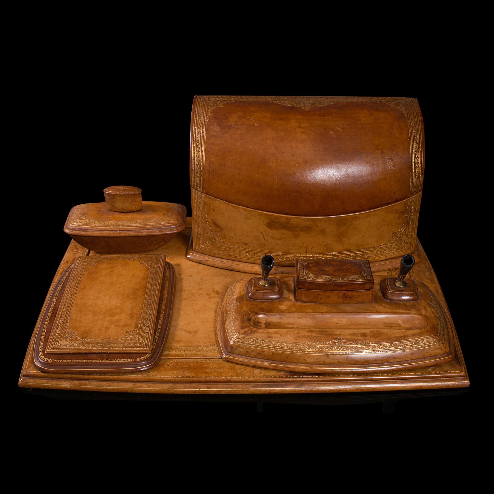 This is a quality vintage writing desk set. An English, leather table rest, pen stand and correspondence box by Asprey of London, dating to the early 20th century, circa 1930.

Of superb quality from a renowned London luxury goods store
Displays