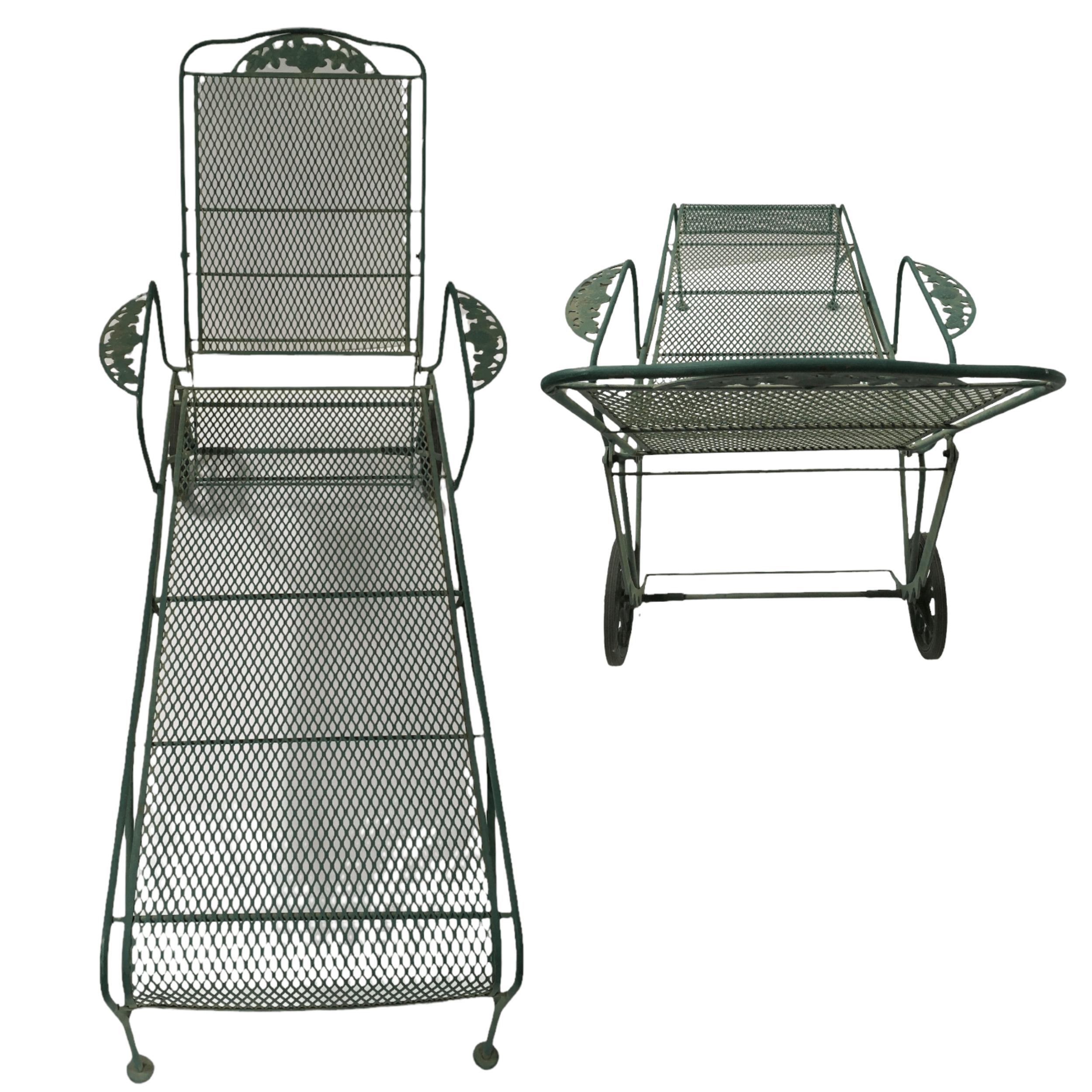Set of two Wrought Iron adjustable back rolling chaise Lounger with mesh seats in Green by Woodard. This set of 2 rolling loungers is heavily made with a wrought iron frame and steel mesh seats in green with an adjustable back with 5 possible