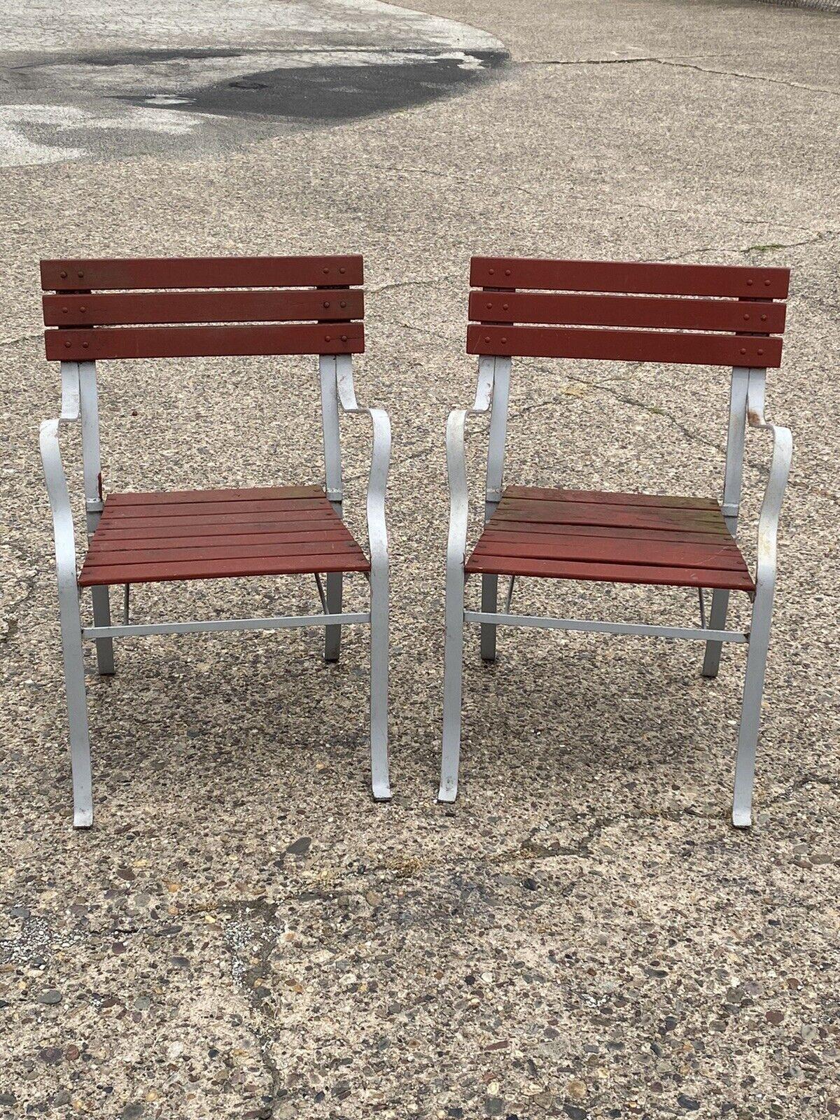 Vintage wrought iron and wood slat French style garden outdoor chairs - a pair. *Price is for (1) pair. Currently (3) pairs available*. Item features wooden slat back and seat, iron frame, red painted finish, original label, great style and form.