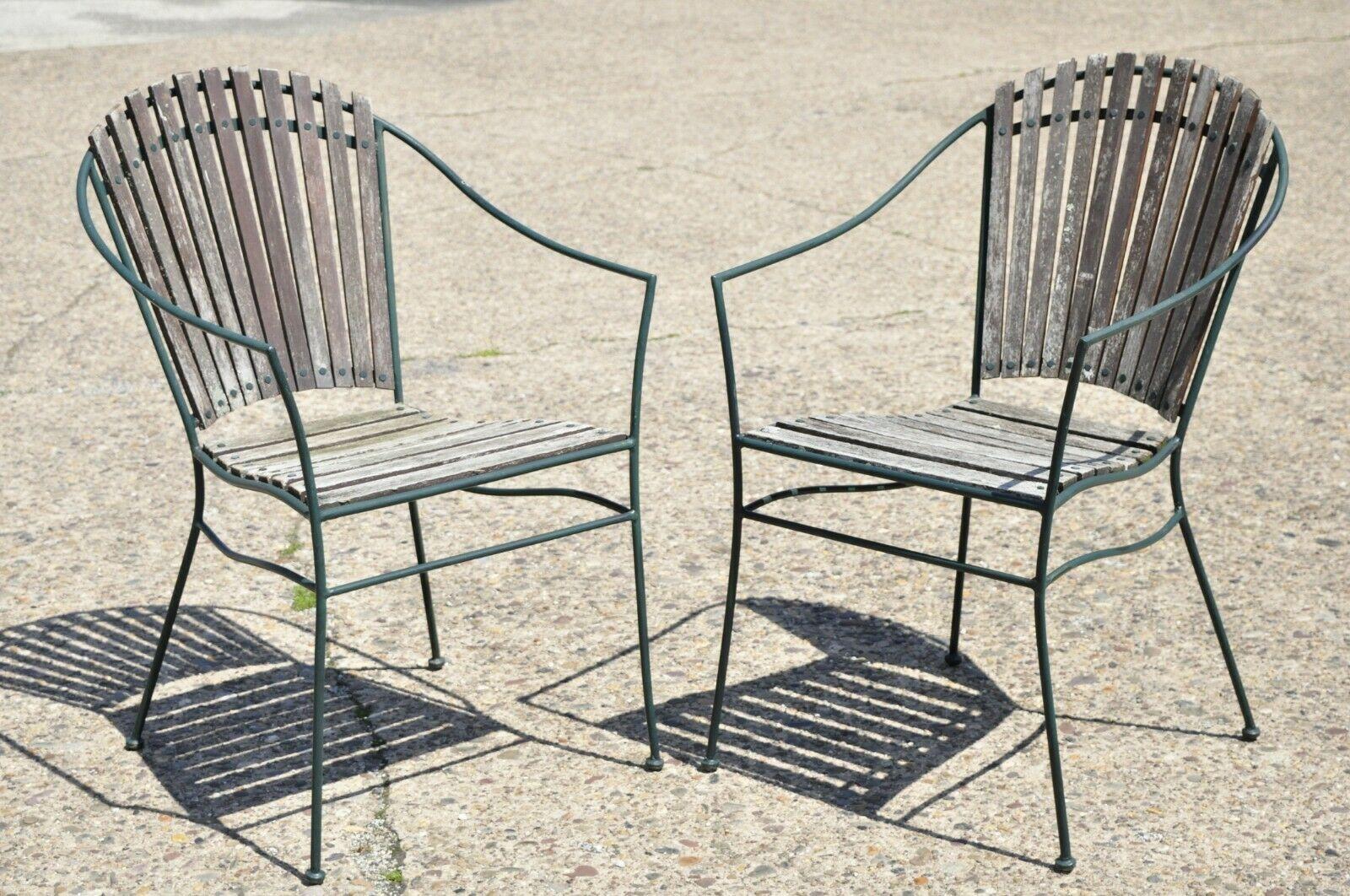 Vintage Wrought Iron and Wood Slat Garden Patio Dining Arm Chairs - Set of 4. Item features (4) armchairs, wrought iron frames, wood slat back and seats, very nice vintage set, sleek sculptural form. Circa Mid to Late 20th Century.
Measurements: