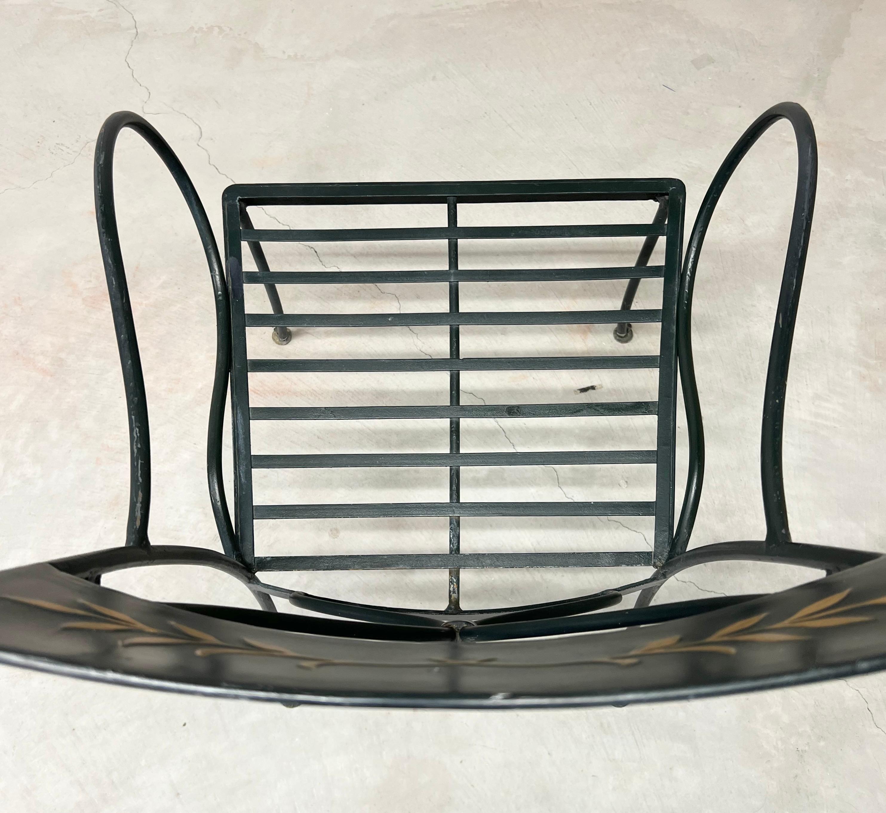 1950s Wrought iron sculptural chair set with original gold painted leaf detailing.  These chairs work for indoor or outdoor spaces adding a touch of regency.  They are also a modern take on the famed French Arras-style garden seating of the early