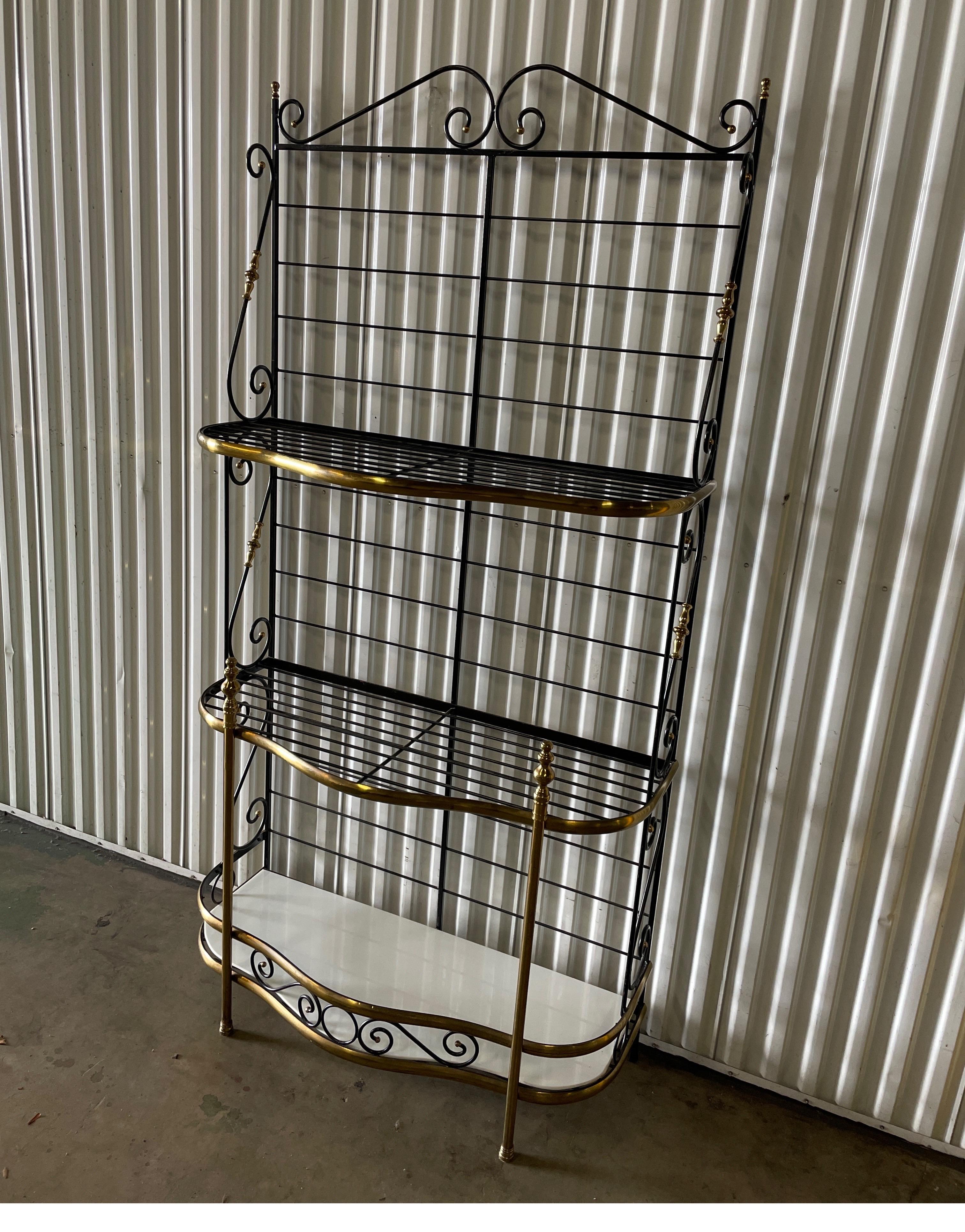 Vintage iron & brass three shelf Baker's rack with later added milk glass shelves.
The size is perfect for many locations.