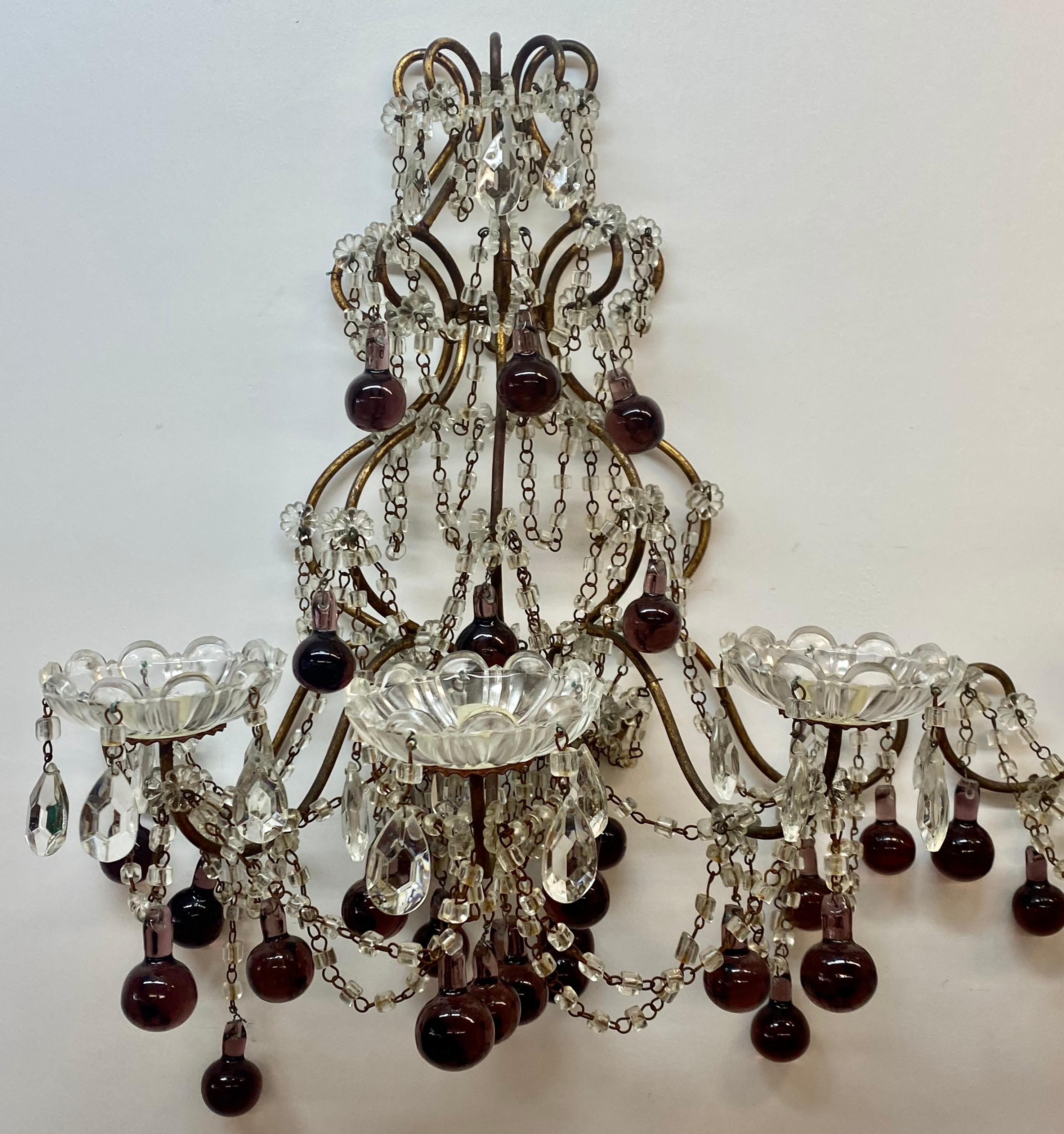 Vintage wrought iron, crystal & glass wall sconces c.1930

Sumptuous pair of wall sconces with pressed glass, crystal and purple glass drops

Each sconce measures 16