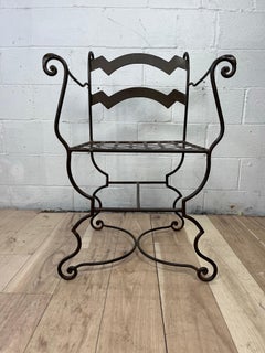 Fauteuil curule vintage en fer forgé avec motifs en volutes, vers les années 1960