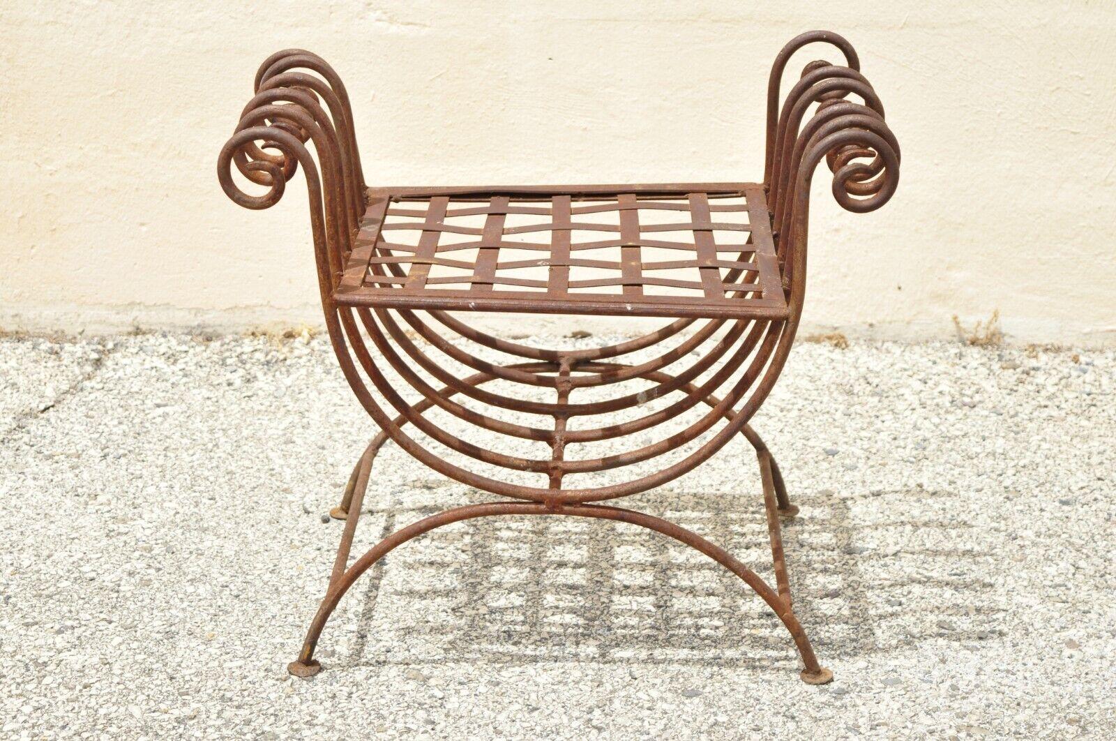 Vintage Wrought Iron Curule Bench Scrolling Rusty Metal Bench X - Frame. Item features scrolling wrought iron frame, curule x-frame design, rusty finish, great style and form. Circa Mid 20th Century. Measurements: 21