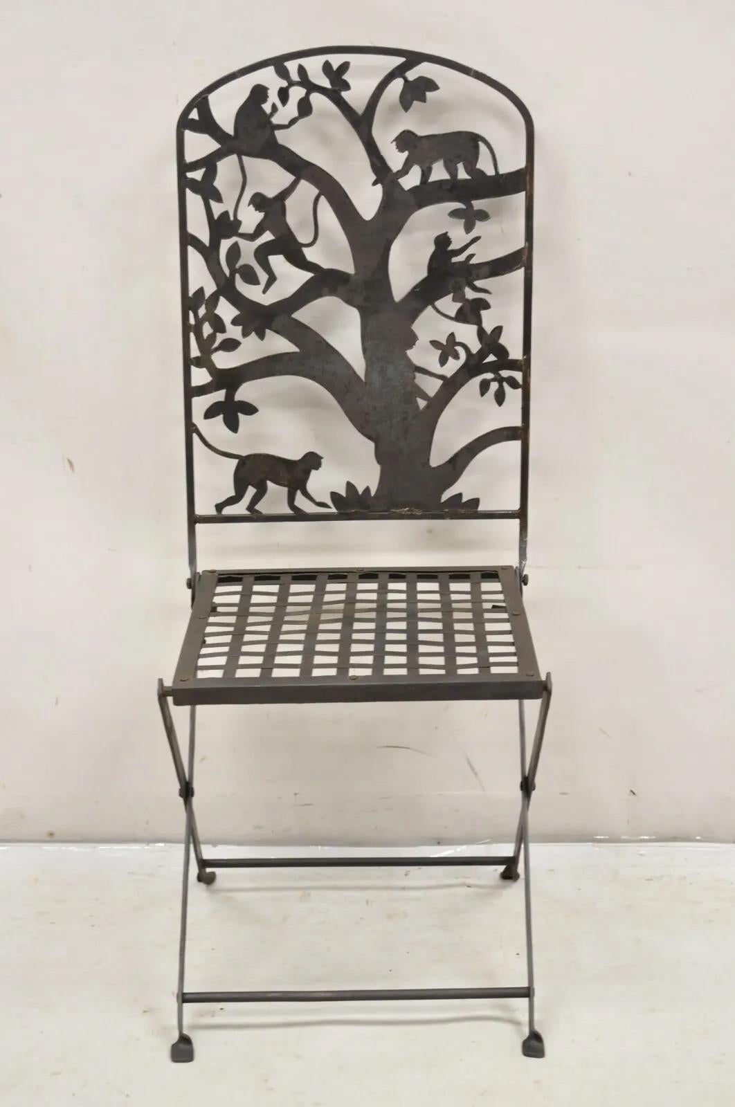 Vintage Wrought Iron Figural Monkeys In Tree Folding Garden Accent Chair. Item features a folding frame, weathered rustic finish, unique vintage chair. Circa  Mid to Late 20th Century. Measurements: 42
