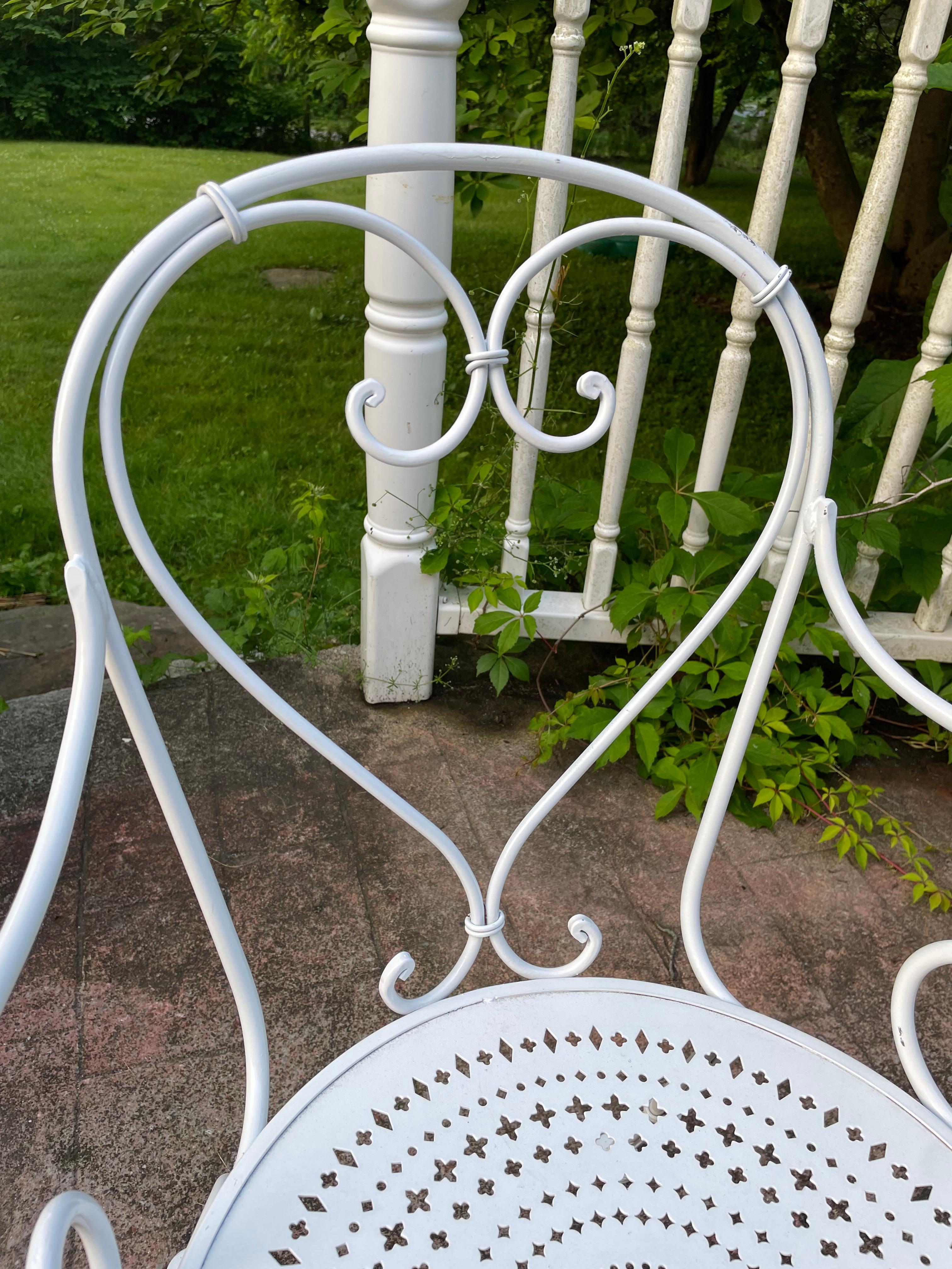 Vintage Wrought Iron French Cafe Bistro Set

Adorable seating for 2. Well proportioned table of 32 inches perfect for any evening out on the terrace, in the garden, or pool side. Folding table provides the convenience of easy storage. Available