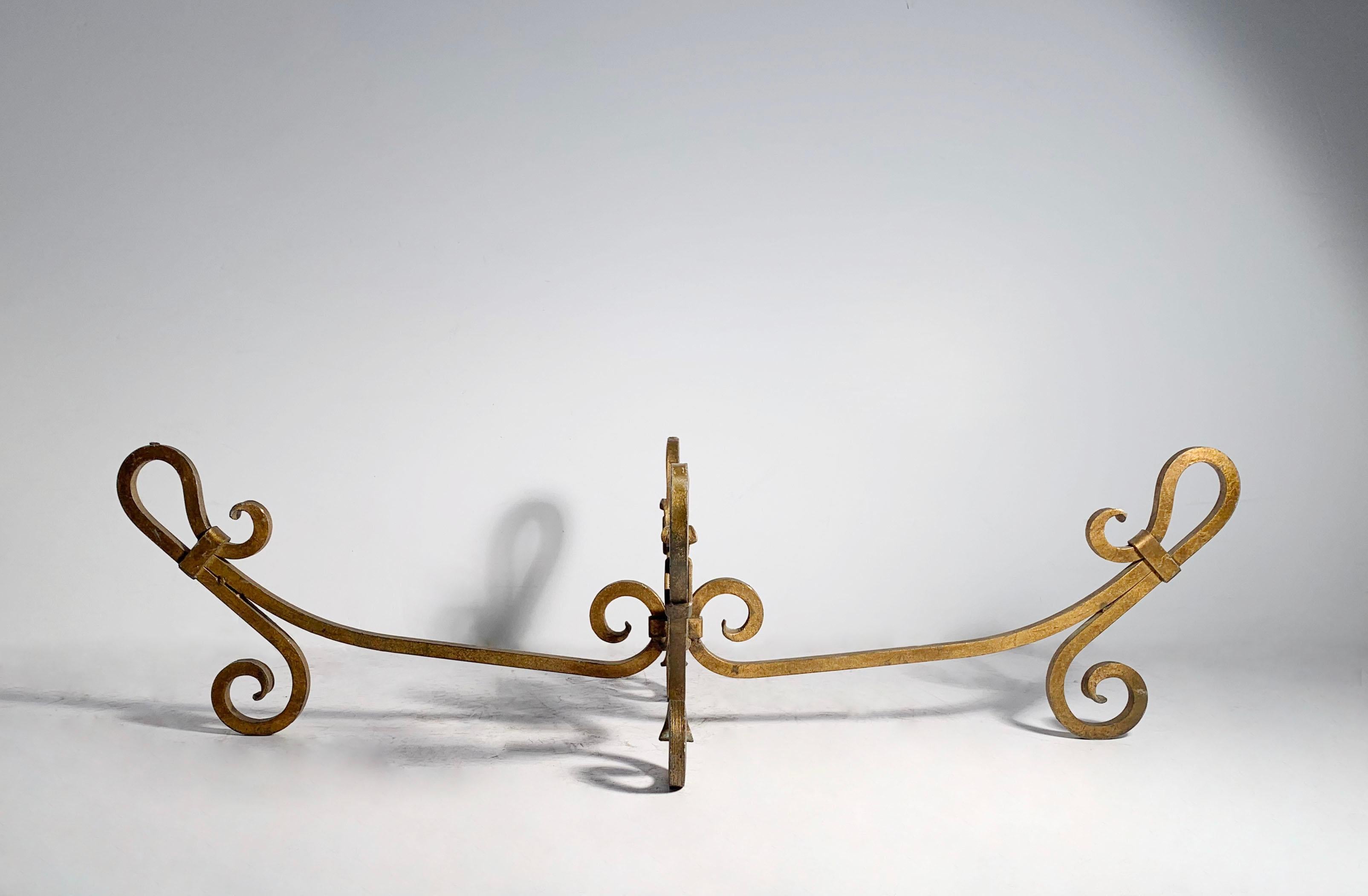 A beautiful Vintage wrought iron gilt finish coffee table base. Being sold with no glass. The dimensions provided are estimated with glass.

In the manner of Gilbert Poillerat , Maison Ramsay , Arturo Pani

The exact dimensions of the base alone