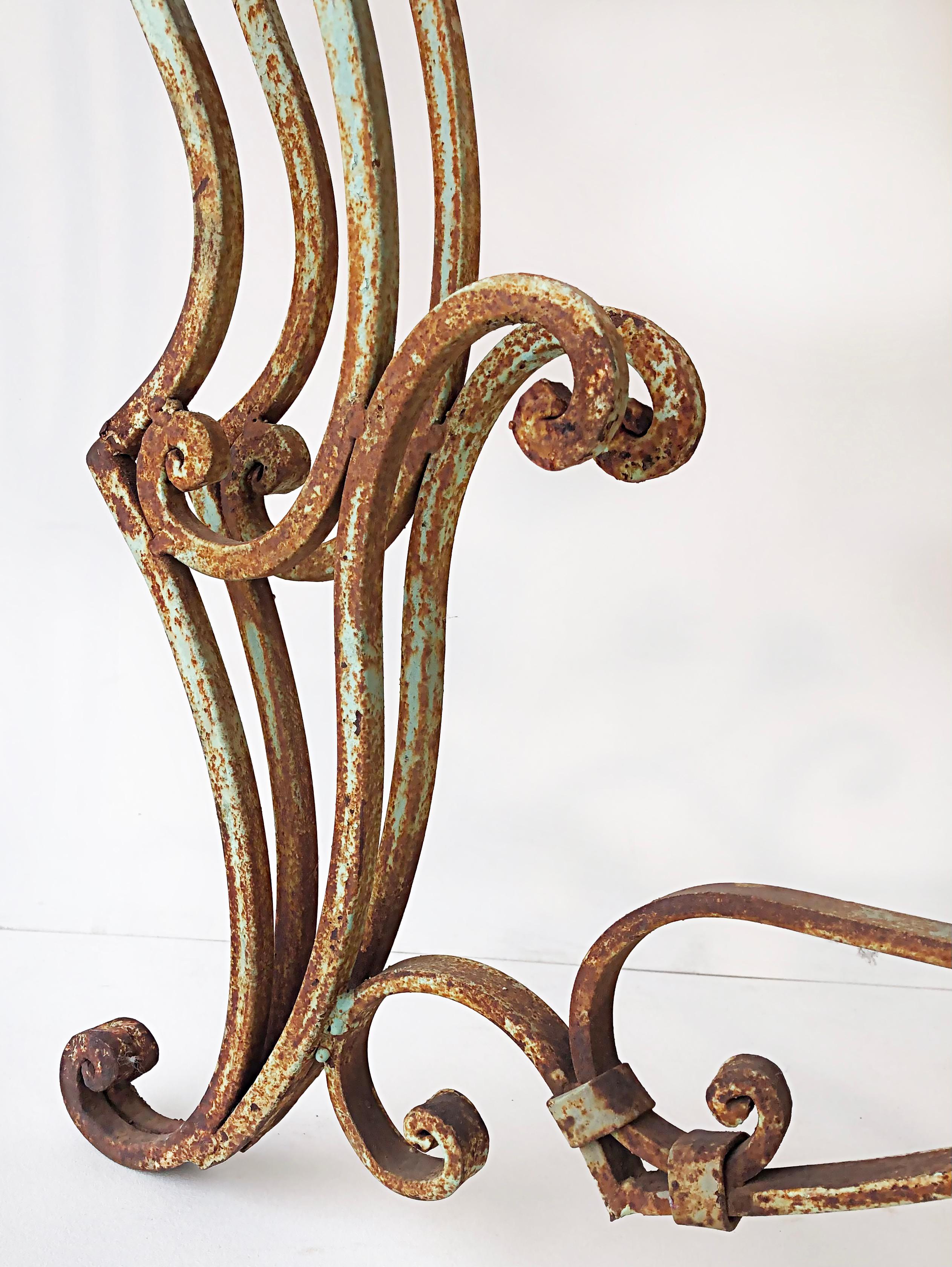 Mid-Century Modern Vintage Wrought Iron Marble Top Garden Table with Scrollwork and Flowers For Sale