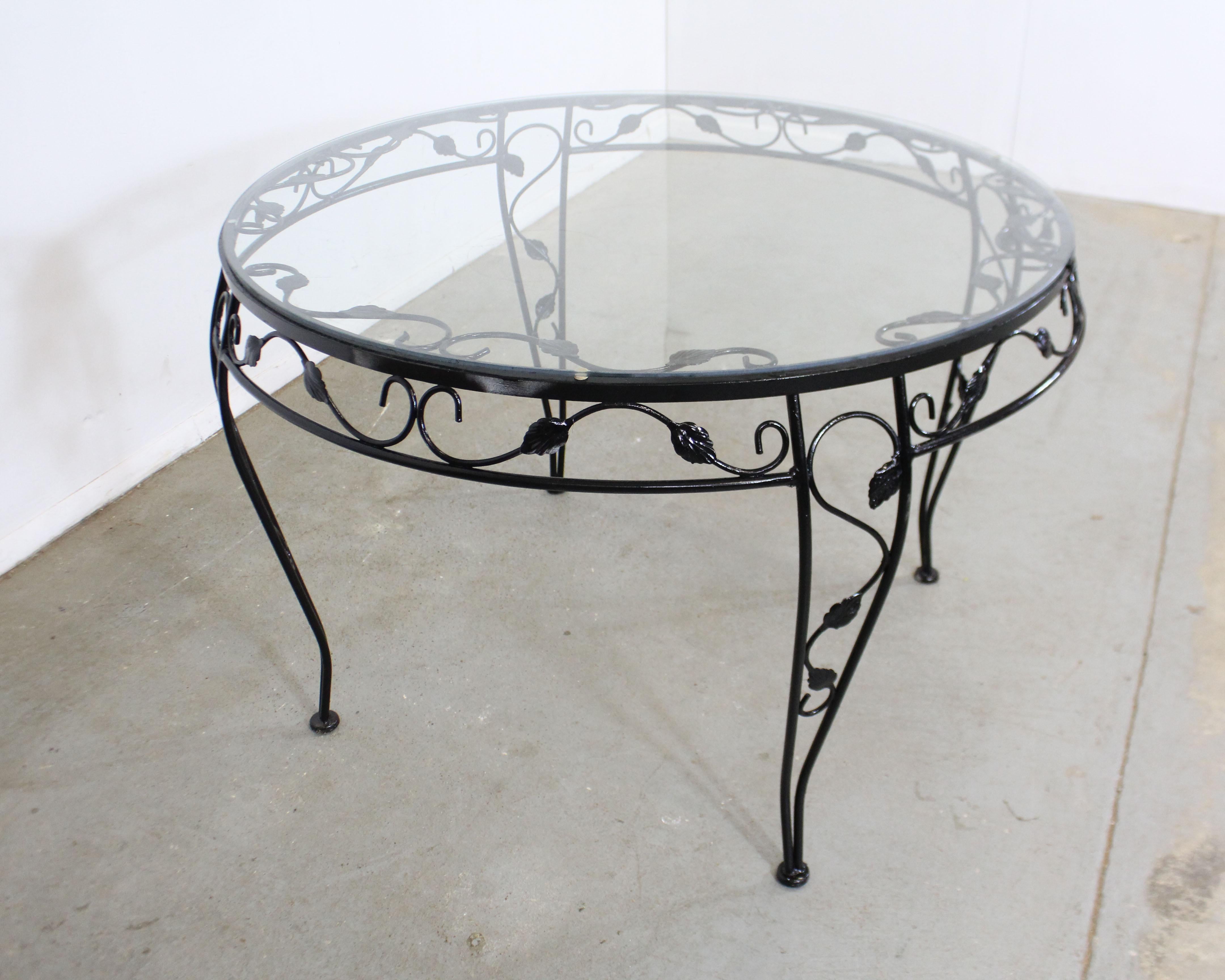 vintage wrought iron table with glass top