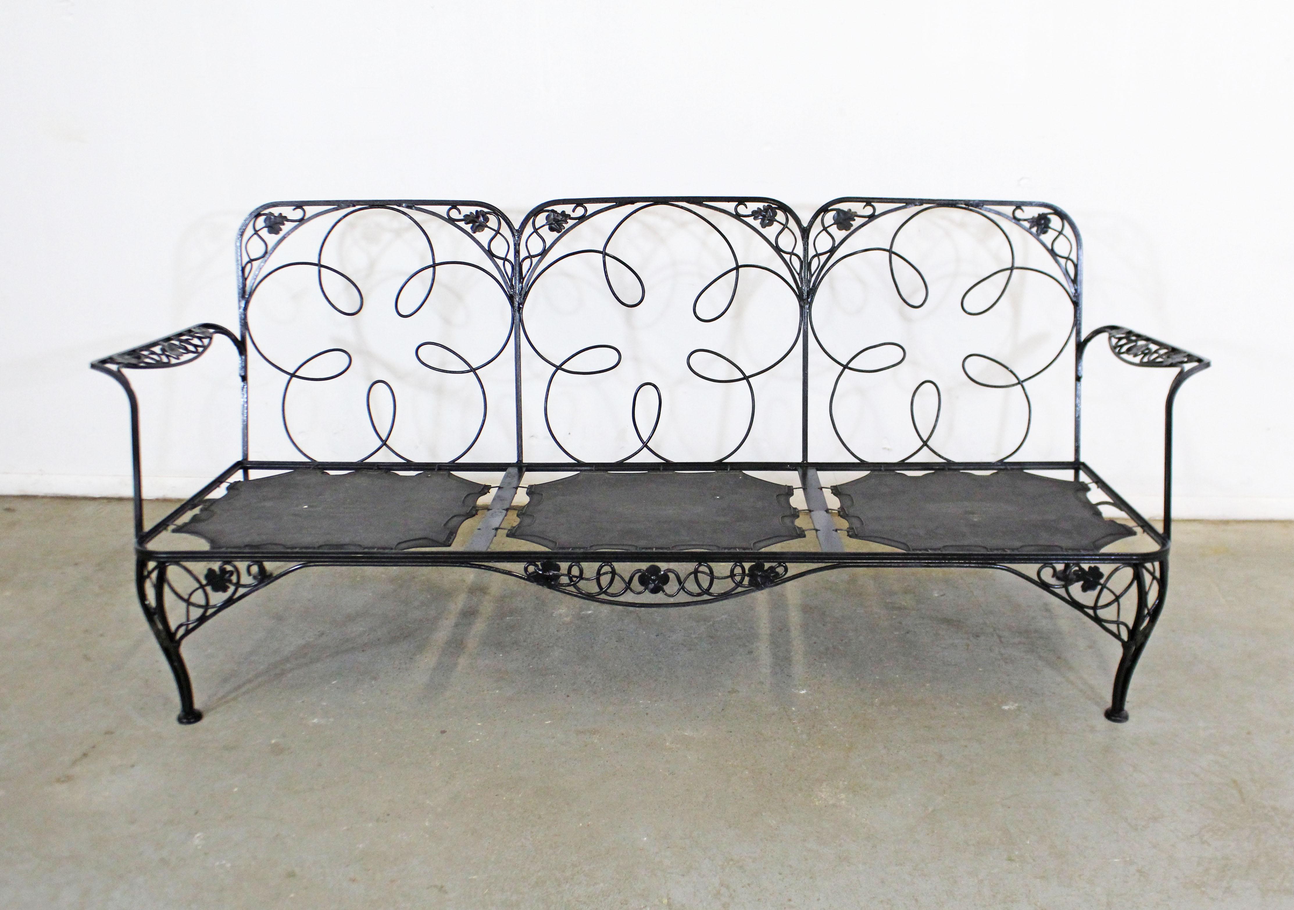 What a find. Offered is a vintage wrought iron sofa frame with a beautiful floral/leaf design. Perfect for an outdoor patio space! It is in good condition, has been repainted, but does not include cushions. It is structurally sound. Seats are marked