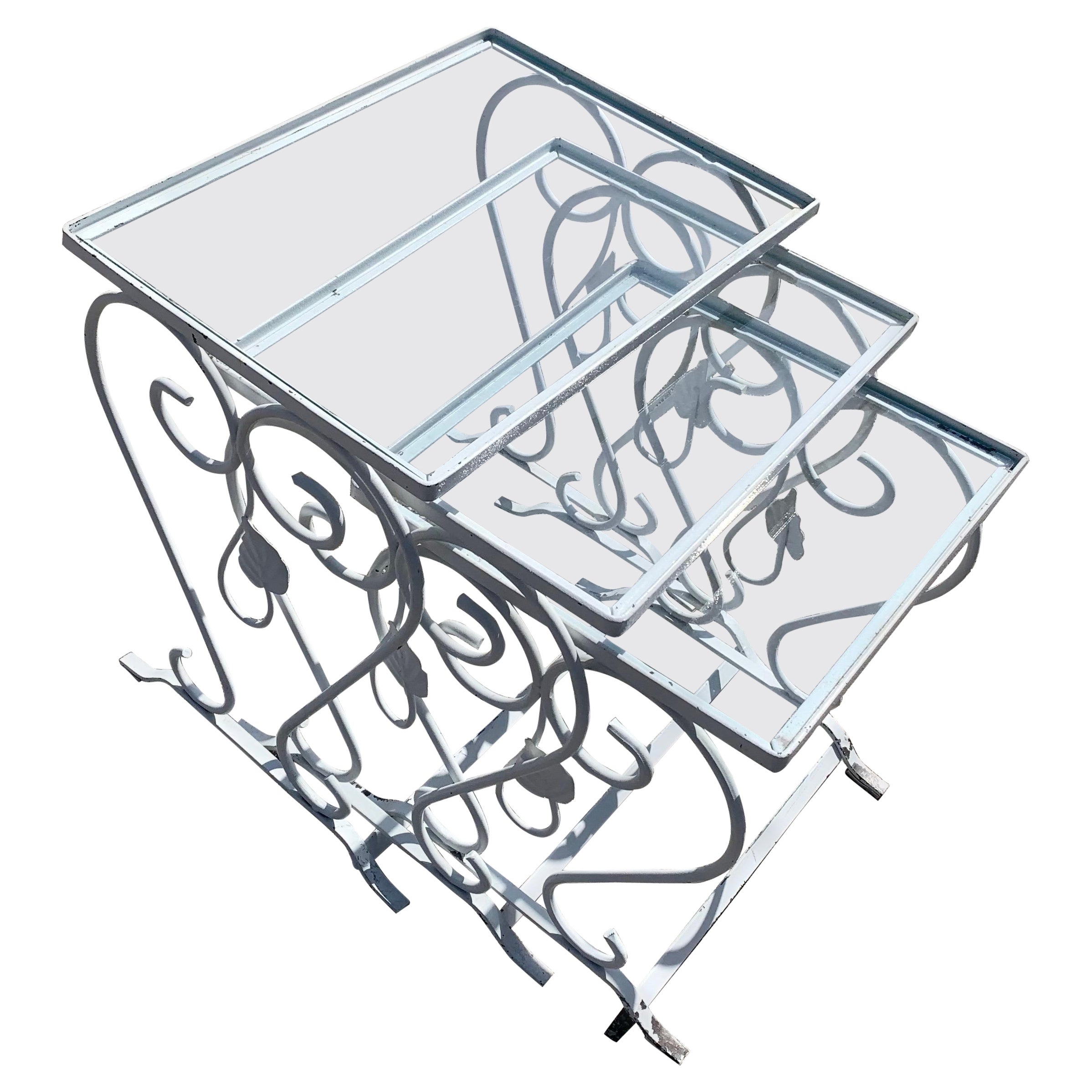 Vintage Wrought Iron Nesting Tables

A Set of 3 beautiful nesting tables with original glass available now and ready to ship complimentary with our in-house shippers. Pair these tables with a vintage wrought iron chaise lounge, arm chair, or sofa,