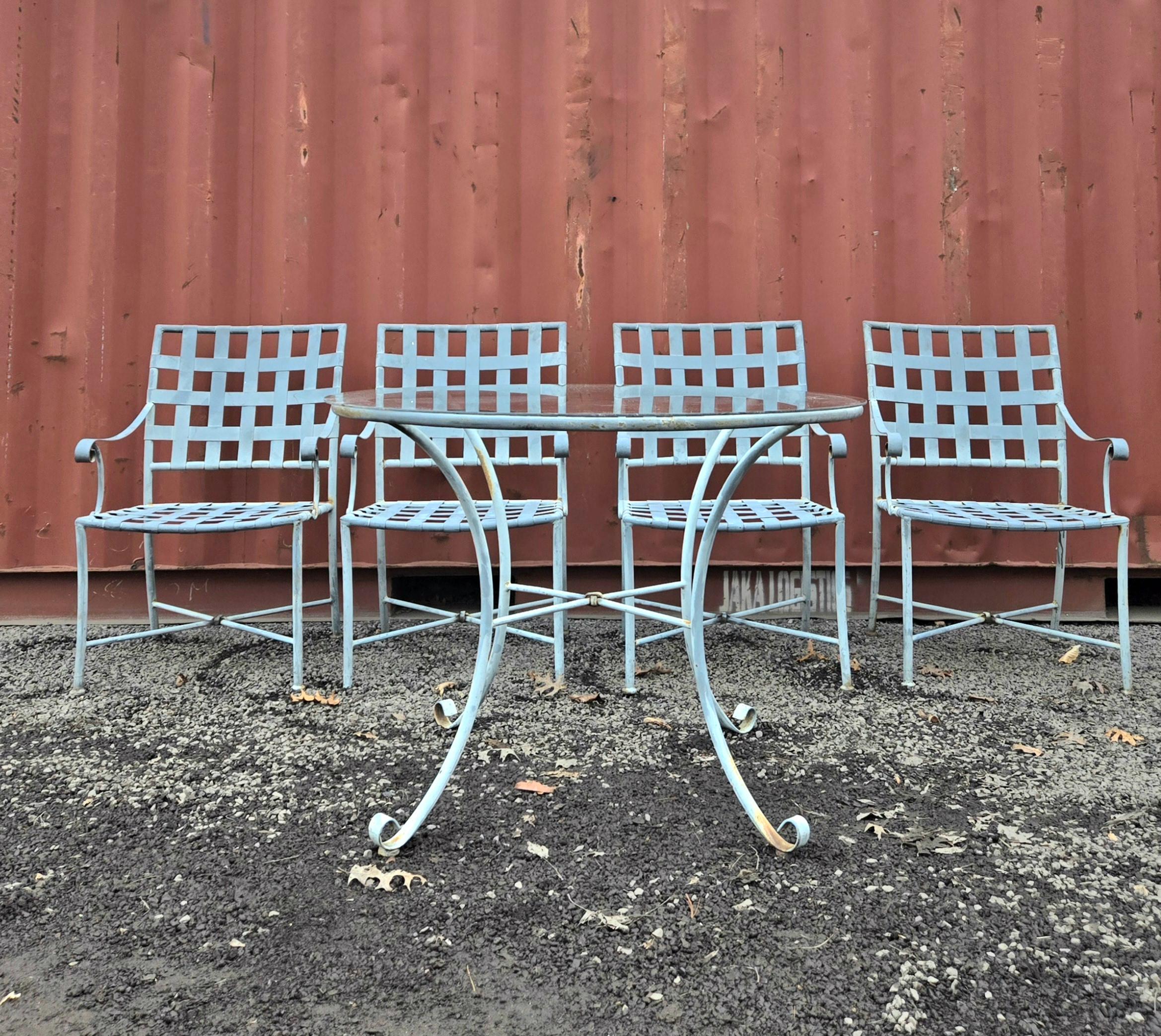 This beautiful Wrought Iron Patio Dining Set by Brown Jordan consists of 4 Chairs and a 42