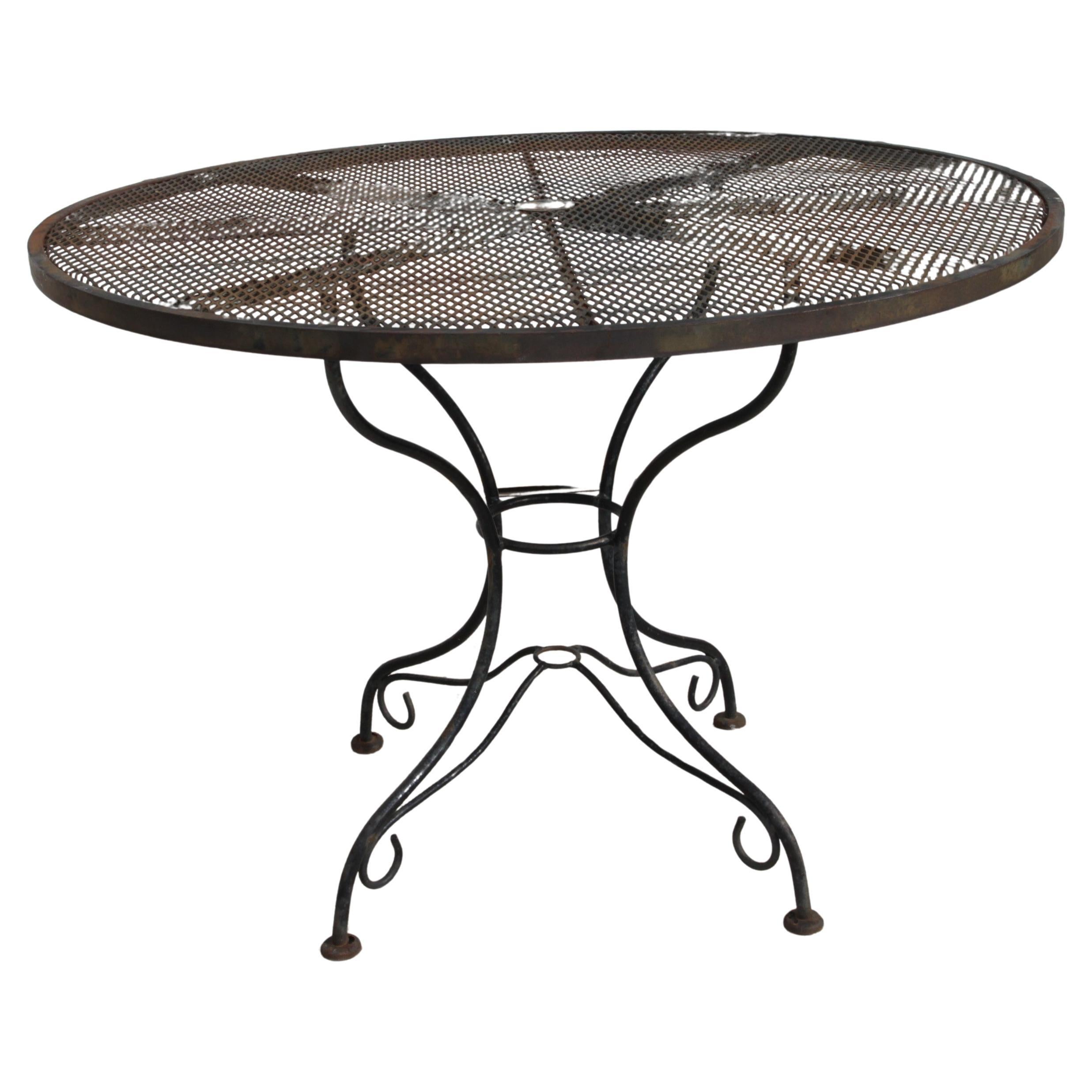Vintage Salterini Wrought Iron Patio Set

Add a touch of timeless elegance to your outdoor space!

This exquisite patio set includes four wrought iron chairs and a matching 54-inch wrought iron table, designed by the renowned. Known for his