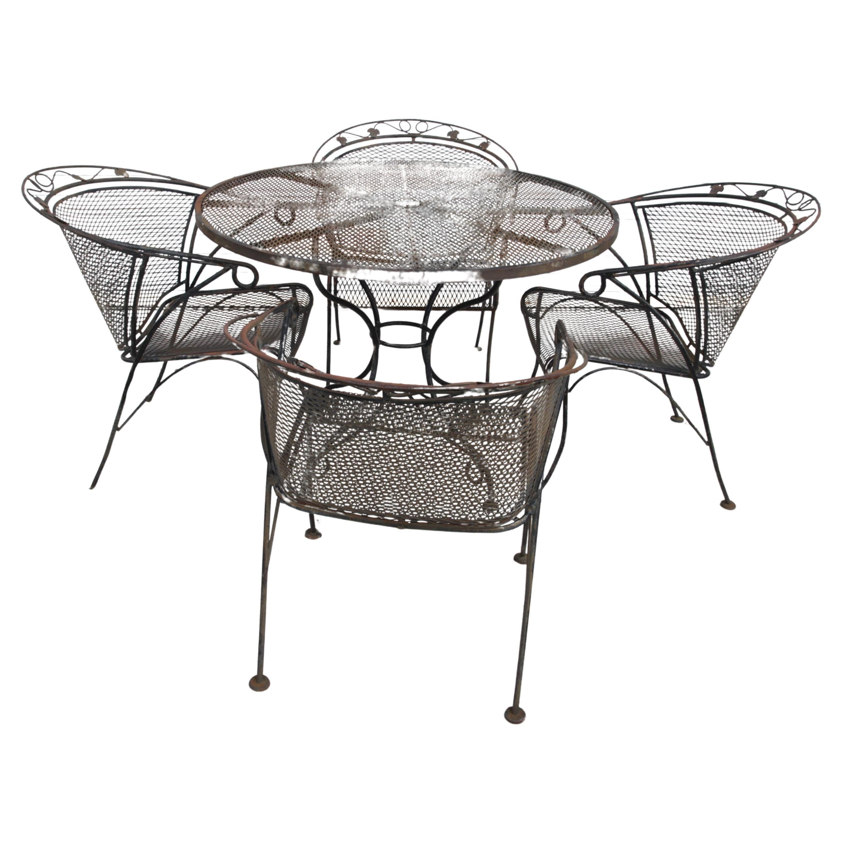 Comedor de exterior de hierro forjado vintage