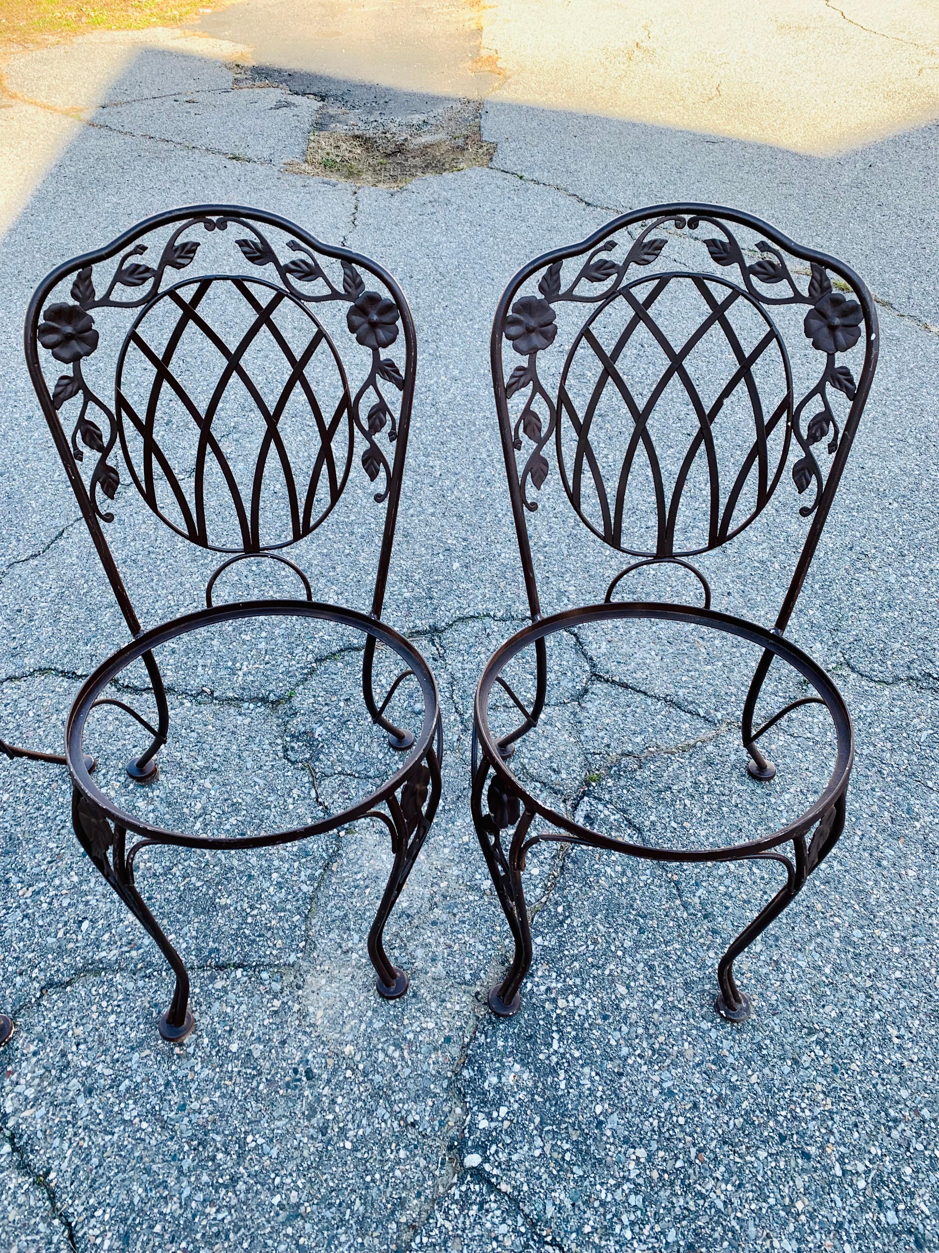 Vintage Wrought Iron Outdoor Seating A Set of 6 Chairs

Perfect for any dining space to accommodate six people. Pairs excellent with the matching 60” dining table. Place these on your deck, garden, or patio while entertaining guests. Ships along