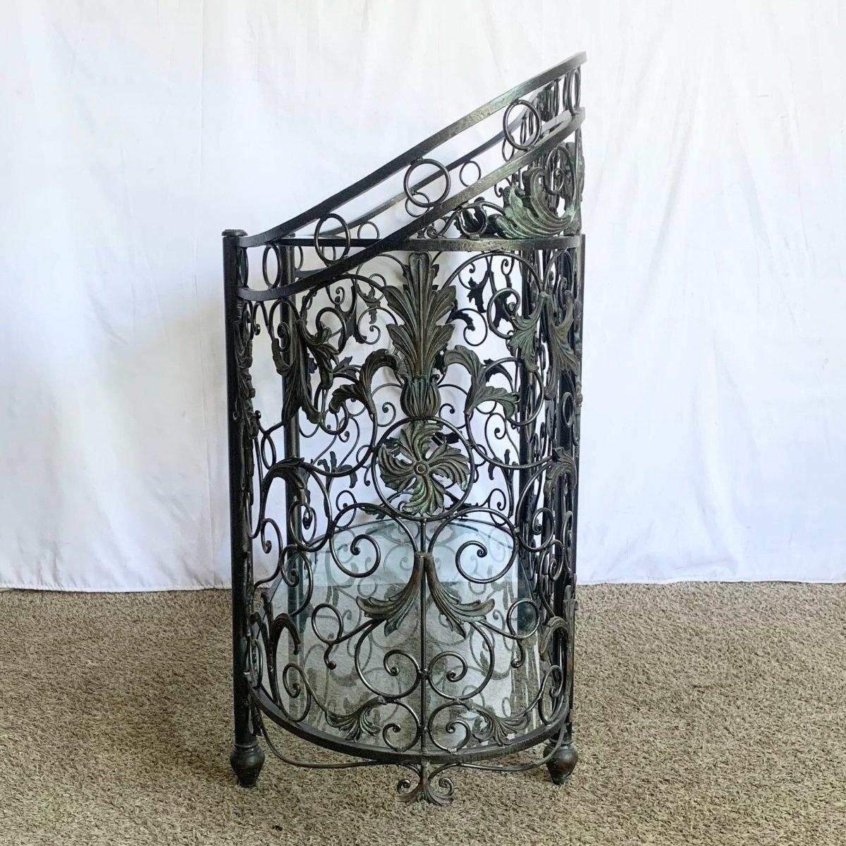 Vintage Wrought Iron Oval Console Table by Maitland Smith blends sculptural ironwork, dual glass tiers, and Mediterranean patina for timeless elegance.
 

 We sell items as acquired, without restoring or repairing. Vintage pieces may have